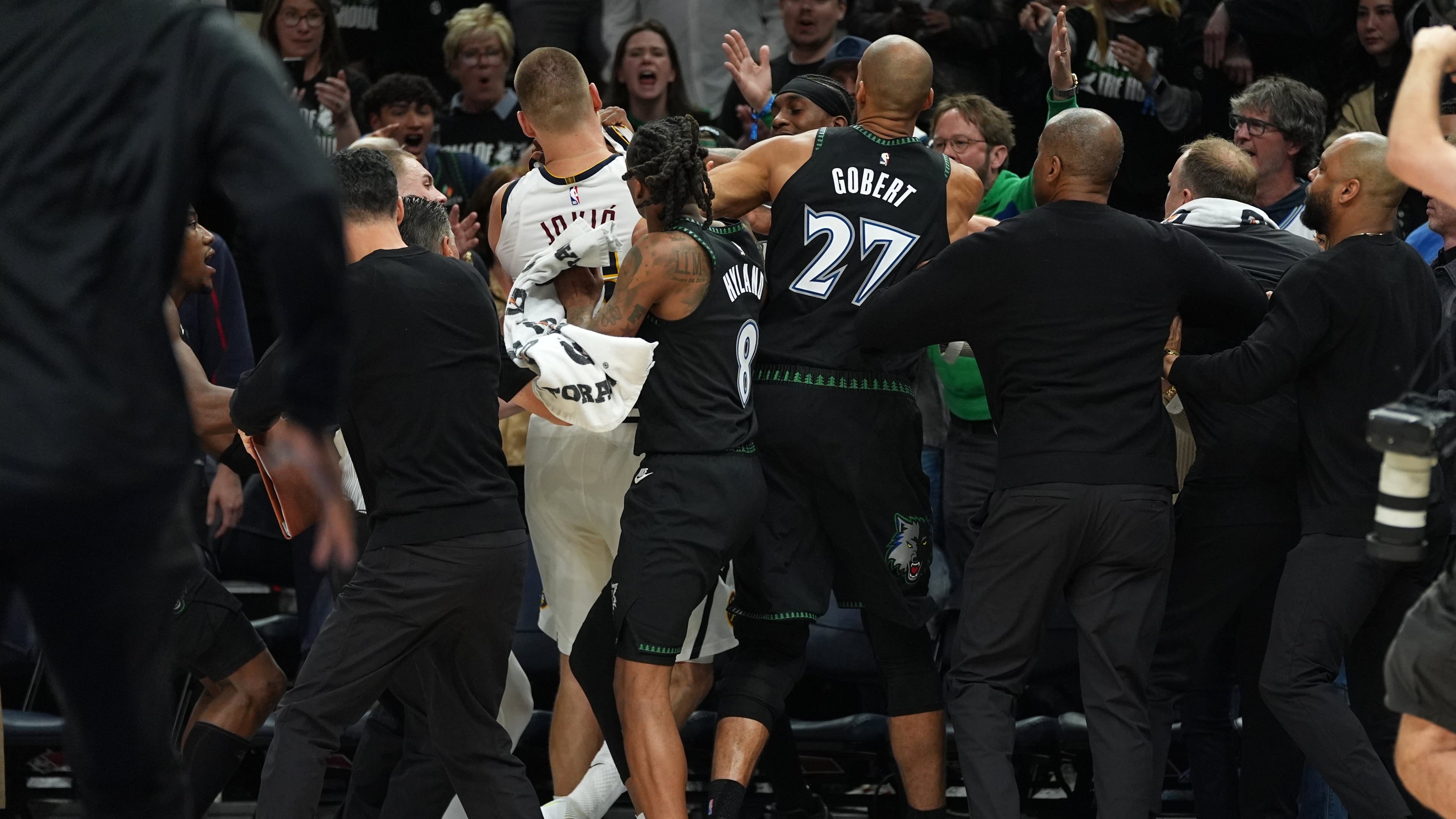 Minnesota Timberwolves and Denver Nuggets players get into an altercation during the second half of Game 4 of a first-round NBA basketball playoff series, Saturday, April 25, 2026, in Minneapolis. (AP Photo/Abbie Parr)