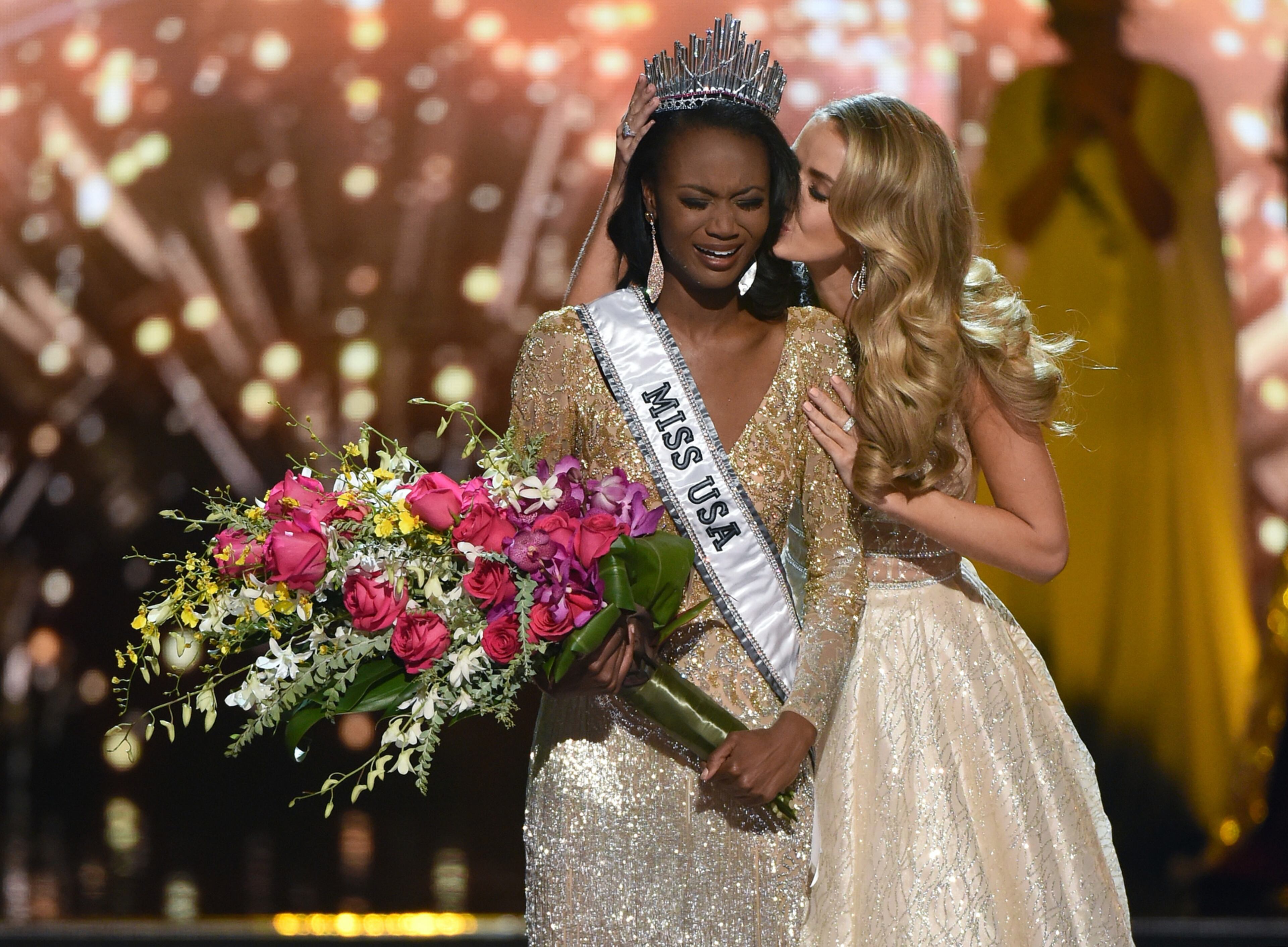 MISS USA CROWNED--LAS VEGAS, NV - JUNE 05: Miss USA 2015 Olivia Jordan (R) kisses Miss District of Columbia USA 2016 Deshauna Barber after crowning her Miss USA 2016 during the 2016 Miss USA pageant at T-Mobile Arena on June 5, 2016 in Las Vegas, Nevada. (Photo by Ethan Miller/Getty Images)