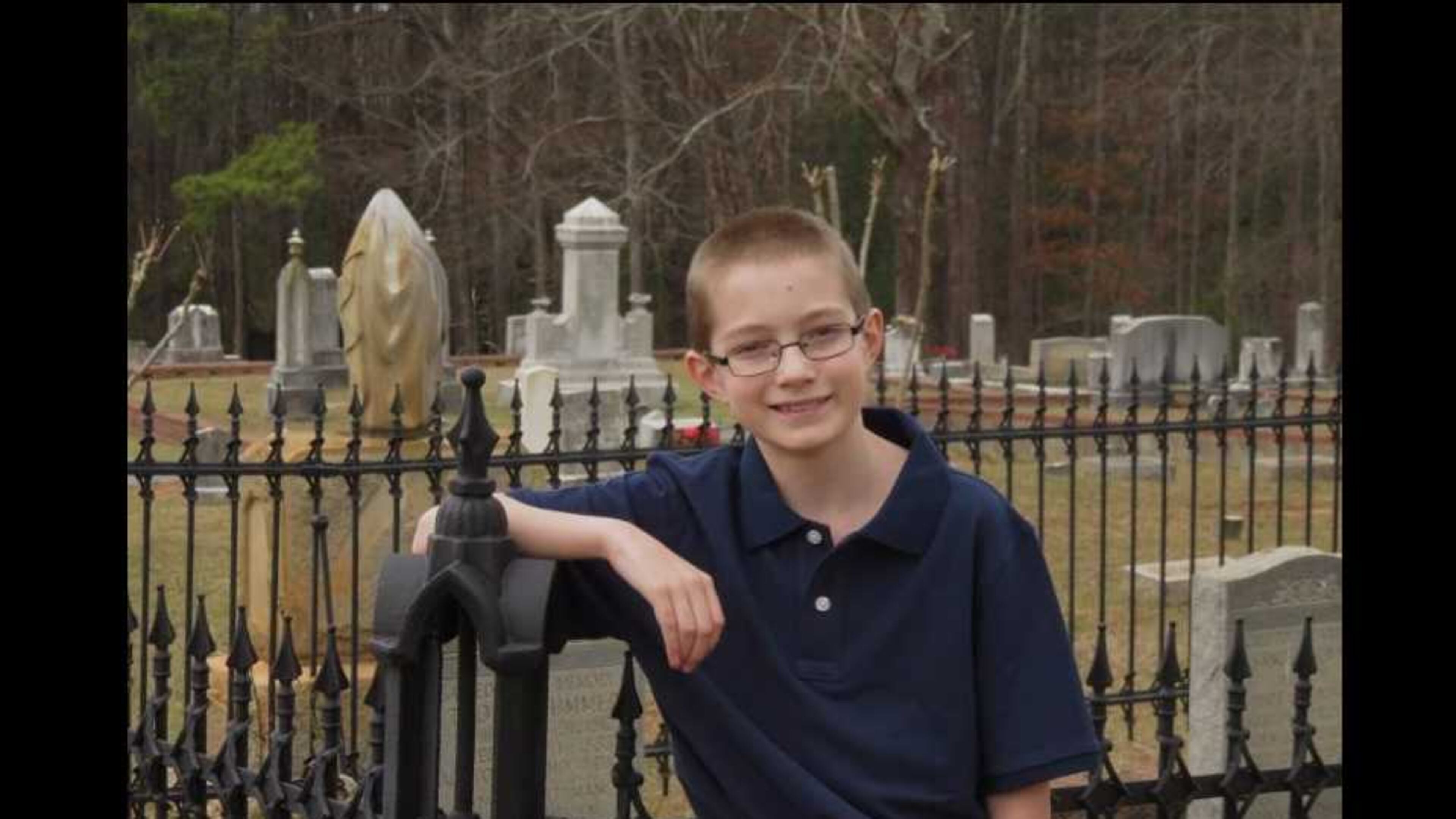 This is Andrew Bramlett posing for a photo in a cemetery. He is 11. Andrew (vice president Kennesaw Historical Society) will give a tour of the Kennesaw Cemetery on Oct. 21, 2017.