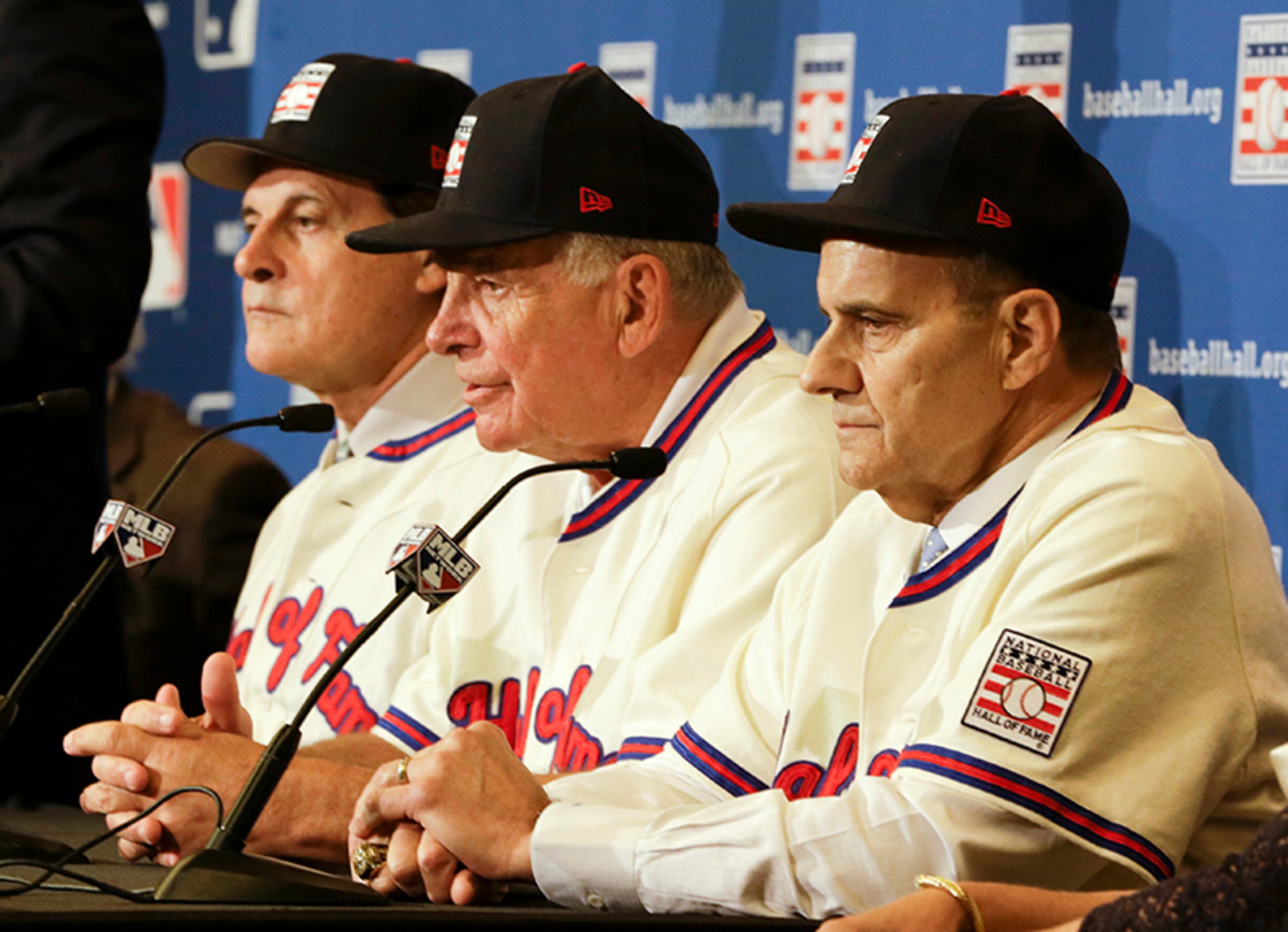 Retired managers Tony La Russa (from left), Bobby Cox and Joe Torre address reporters Monday after it was announced the three were unanimously elected to the baseball Hall of Fame during the MLB winter meetings in Lake Buena Vista, Fla.