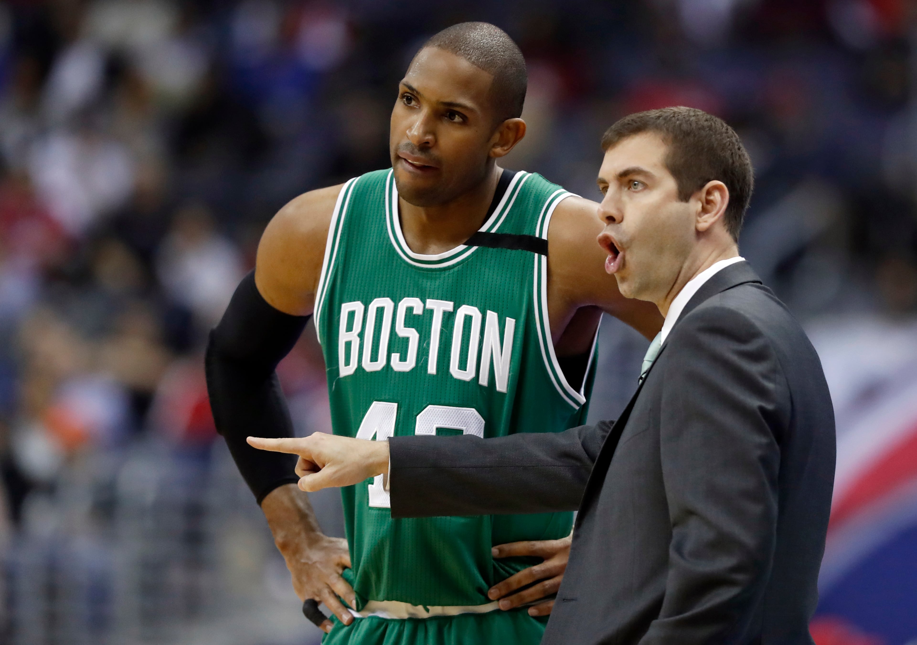 Boston Celtics center Al Horford (42), from the Dominican Republic, and head coach Brad Stevens talk in the first half of game 6 of the Eastern Conference semifinal NBA basketball playoff series against the Washington Wizards, Friday, May 12, 2017, in Washington. (AP Photo/Alex Brandon)