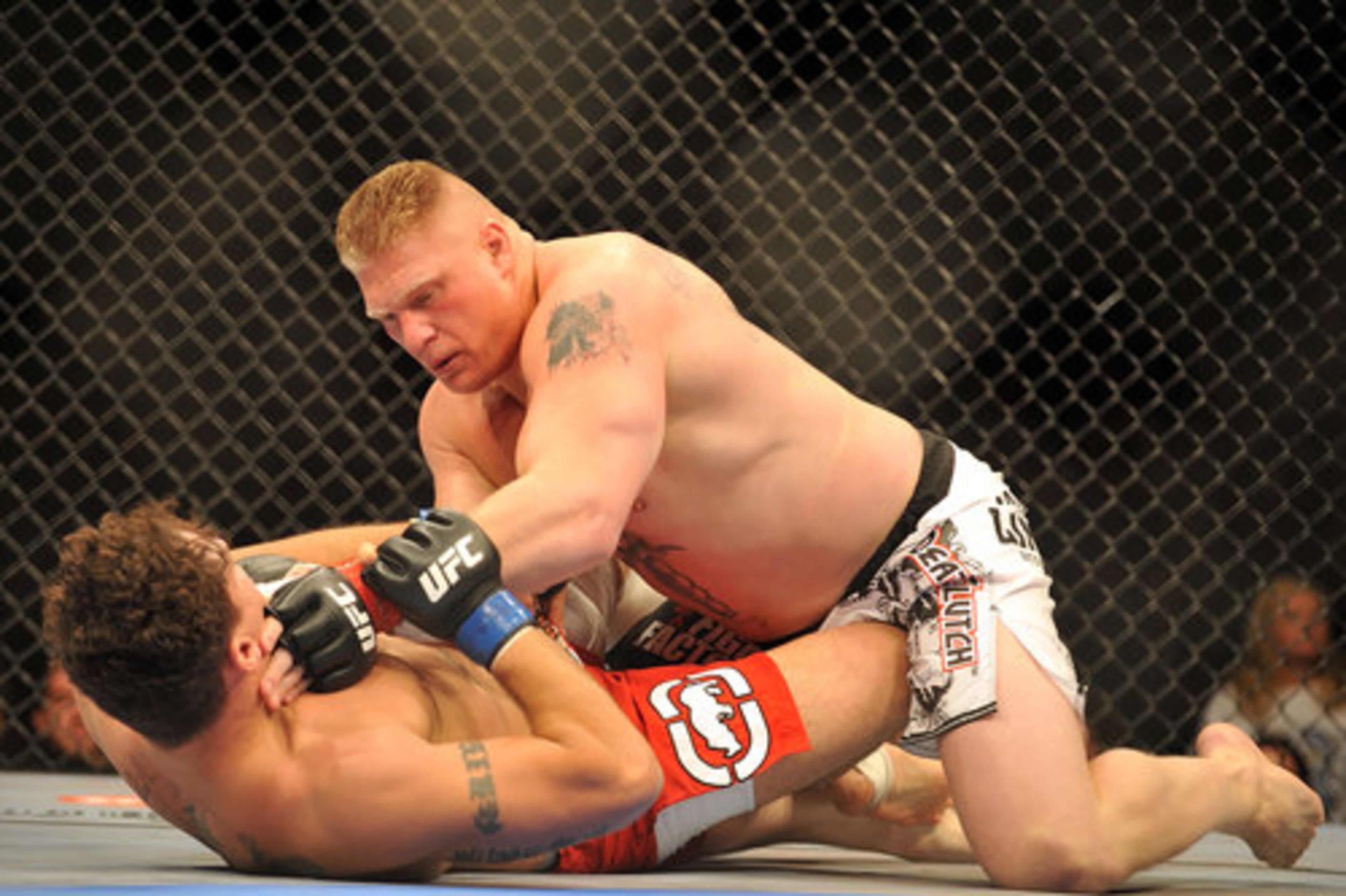 Brock Lesnar is well on his way to becoming mixed martial arts' biggest name. As he showed in UFC 100, he's already its biggest jerk. That's certainly good news for the UFC's bottom line, since fans of any sport love to hate a proper villain. It's not so good for the mainstream image of a sport that publicly claims it wants nothing to do with its heavyweight champion's pro wrestling-style theatrics Saturday night in Las Vegas. He defeated and taunted Frank Mir.