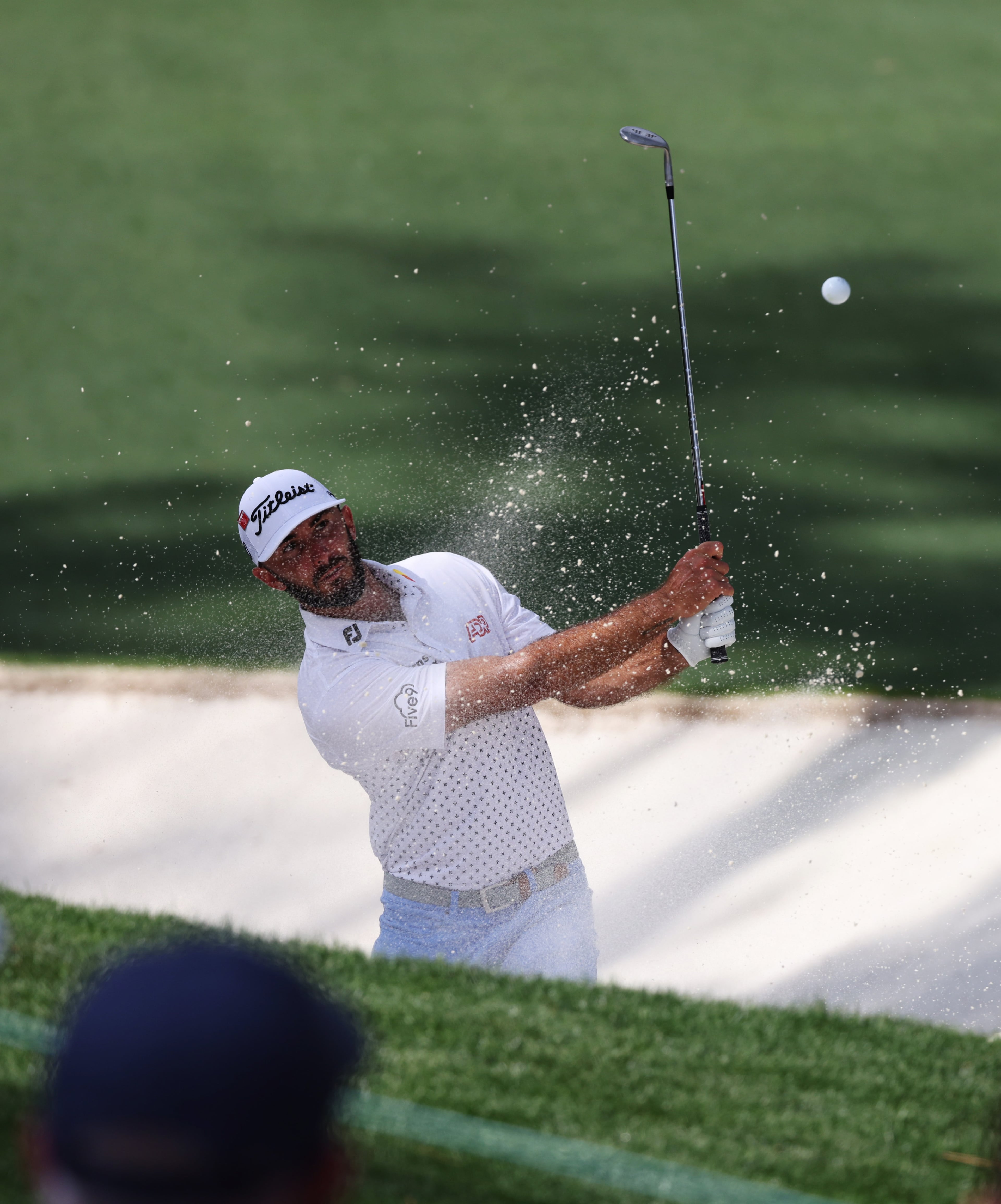 Max Homa hits out of bunker on 10th hole during first round of the 2023 Masters Tournament at Augusta National Golf Club, Thursday, April 6, 2023, in Augusta, Ga. (Jason Getz / Jason.Getz@ajc.com)