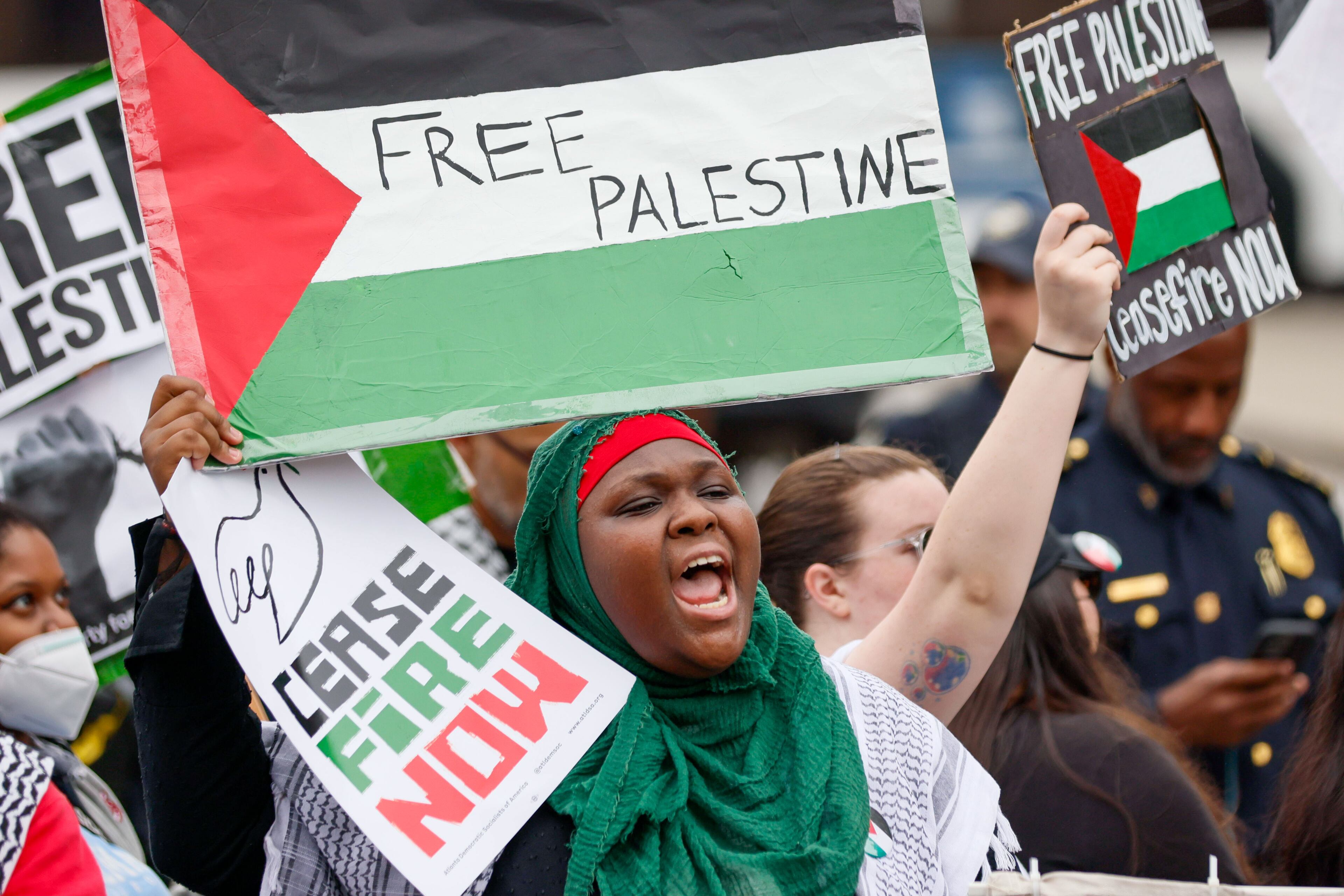 A pro-Palestinian protester chants along with dozens of protester as they stand on Joseph E. Lowery Blvd outside Morehouse College as they protest against President Joe Biden’s visit, who is the main speaker for Morehouse College’s 140th
(Miguel Martinez / AJC)