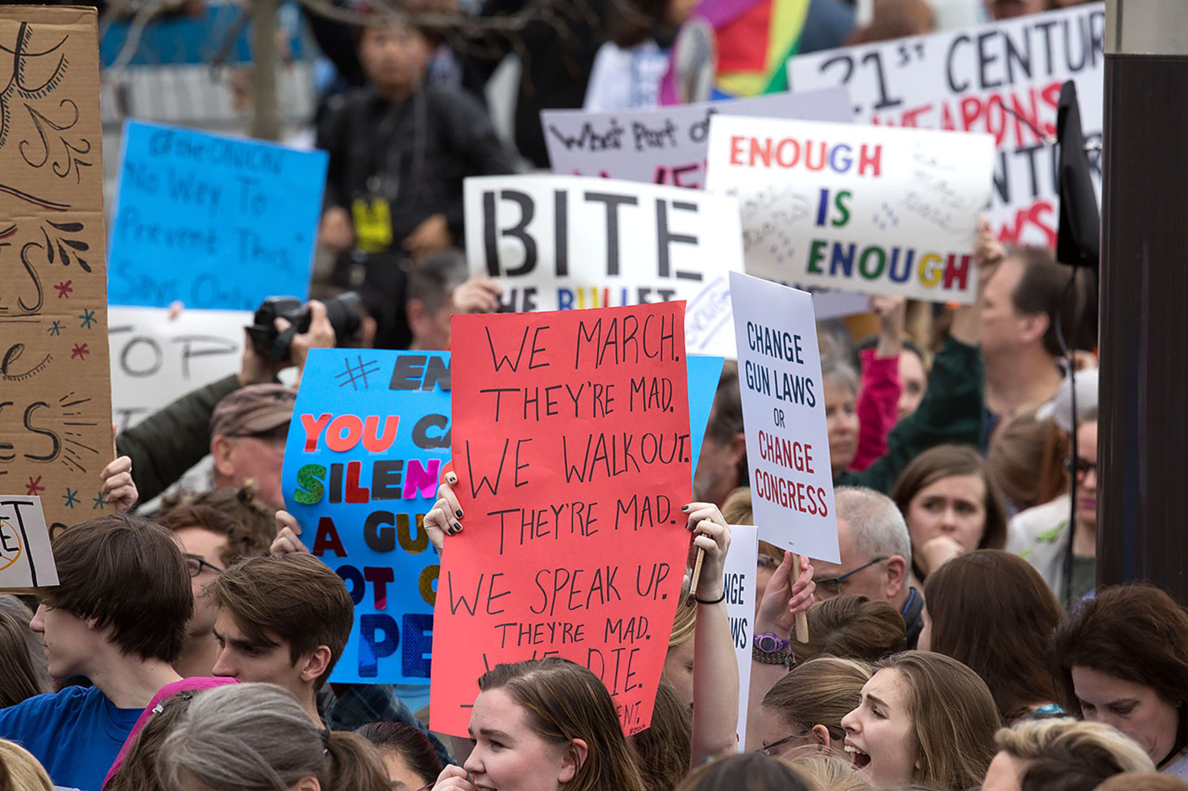 People and signs fill a gathering area in front of the Center for Civil and Human Rights building before the start of the March For Our Life Atlanta rally Saturday, March 24, 2018, The Atlanta police department estimated the crowd at near 30,000 people. STEVE SCHAEFER / SPECIAL TO THE AJC