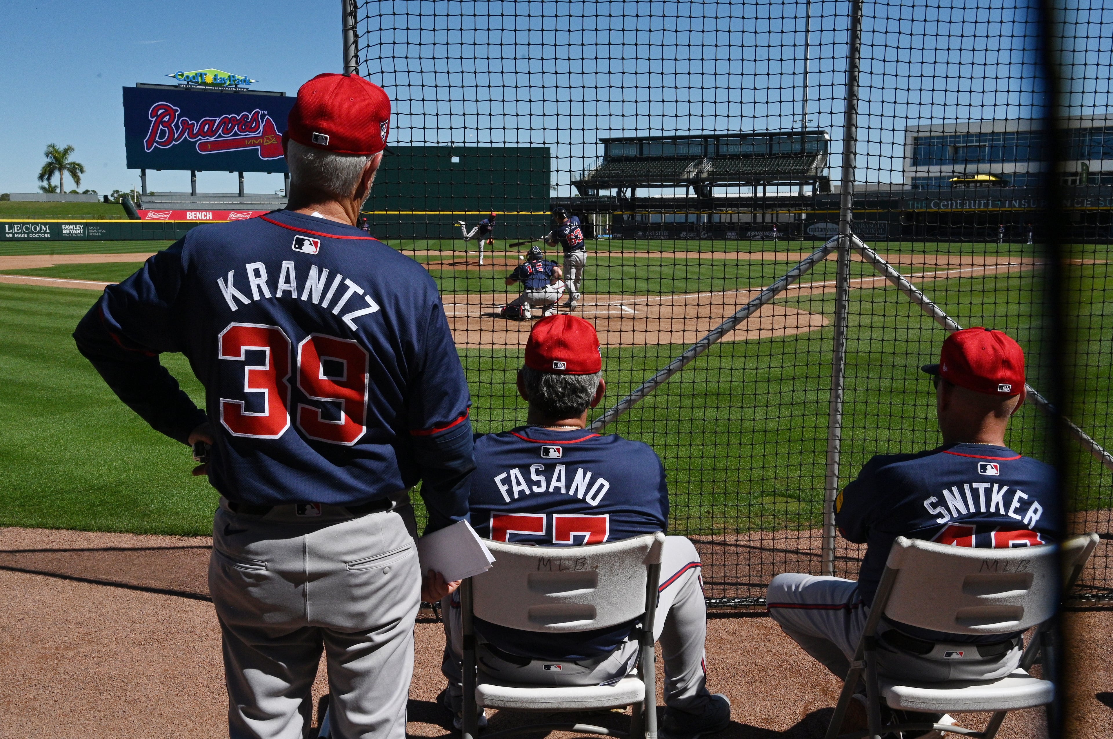The Atlanta Braves coaching staff watch as starting pitcher Chris Sale throws during spring training workouts at CoolToday Park, Thursday, Feb. 22, 2024, in North Port, Florida. (Hyosub Shin / Hyosub.Shin@ajc.com)