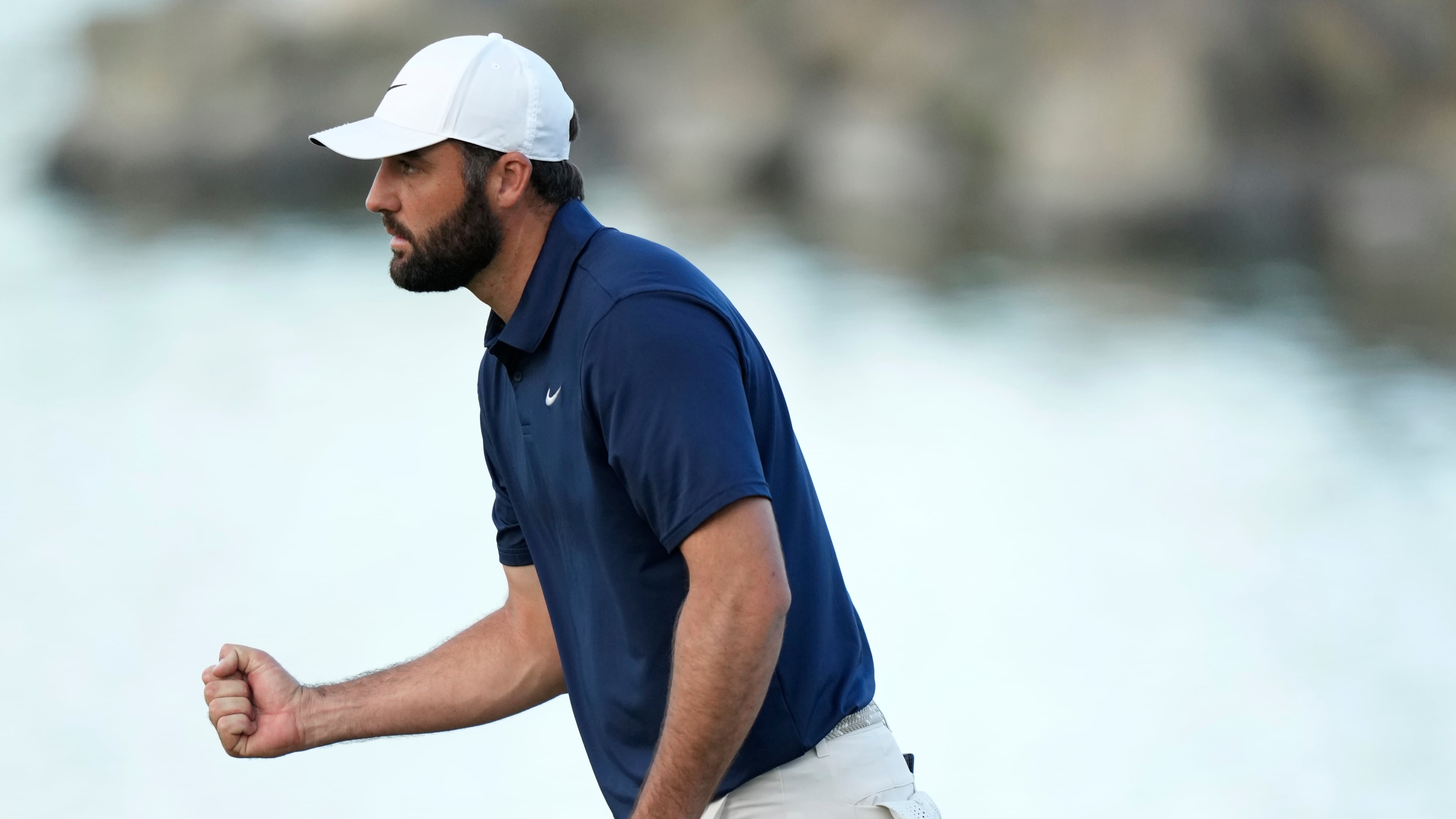 Scottie Scheffler pumps his fist after making a par on the 18th hole during the third round of the American Express golf event on the Pete Dye Stadium Course at PGA West Saturday, Jan. 24, 2026, in La Quinta, Calif. (AP Photo/Ross D. Franklin)