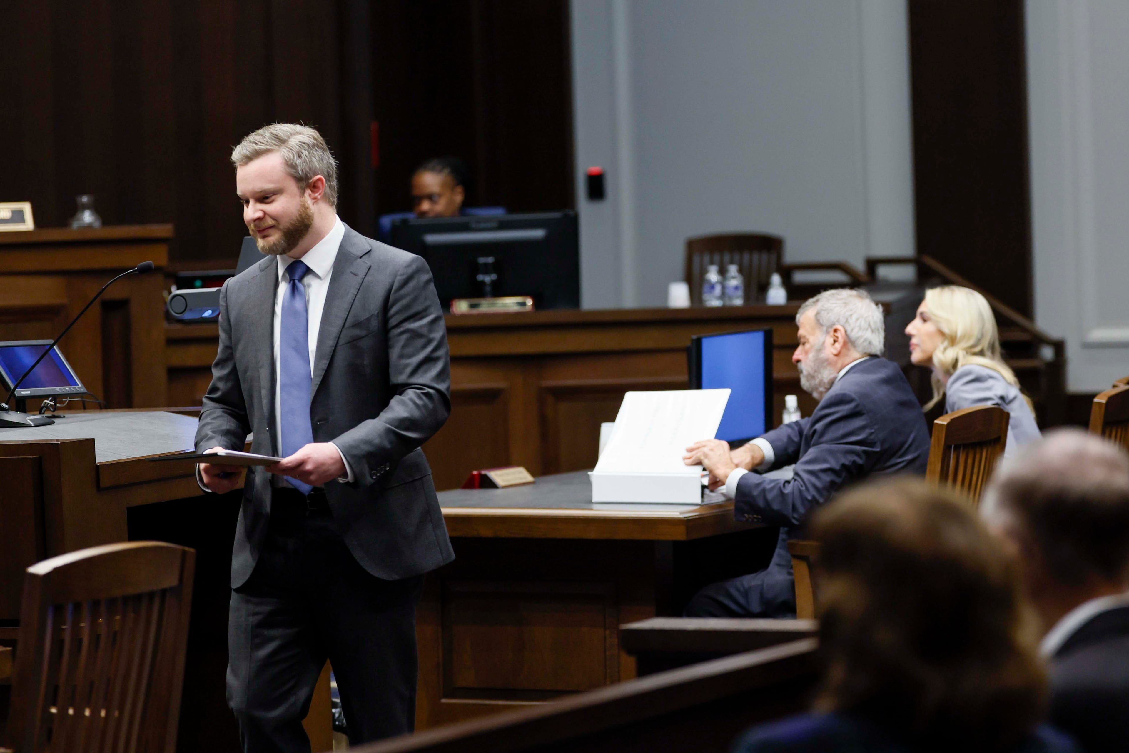 Attorney Justin Gunter (left), representing the Fulton County Republican Party, leaves the podium after presenting arguments before the Georgia Supreme Court on Wednesday, Oct. 14, 2026, at the Nathan Deal Judicial Center. (Miguel Martinez/AJC)