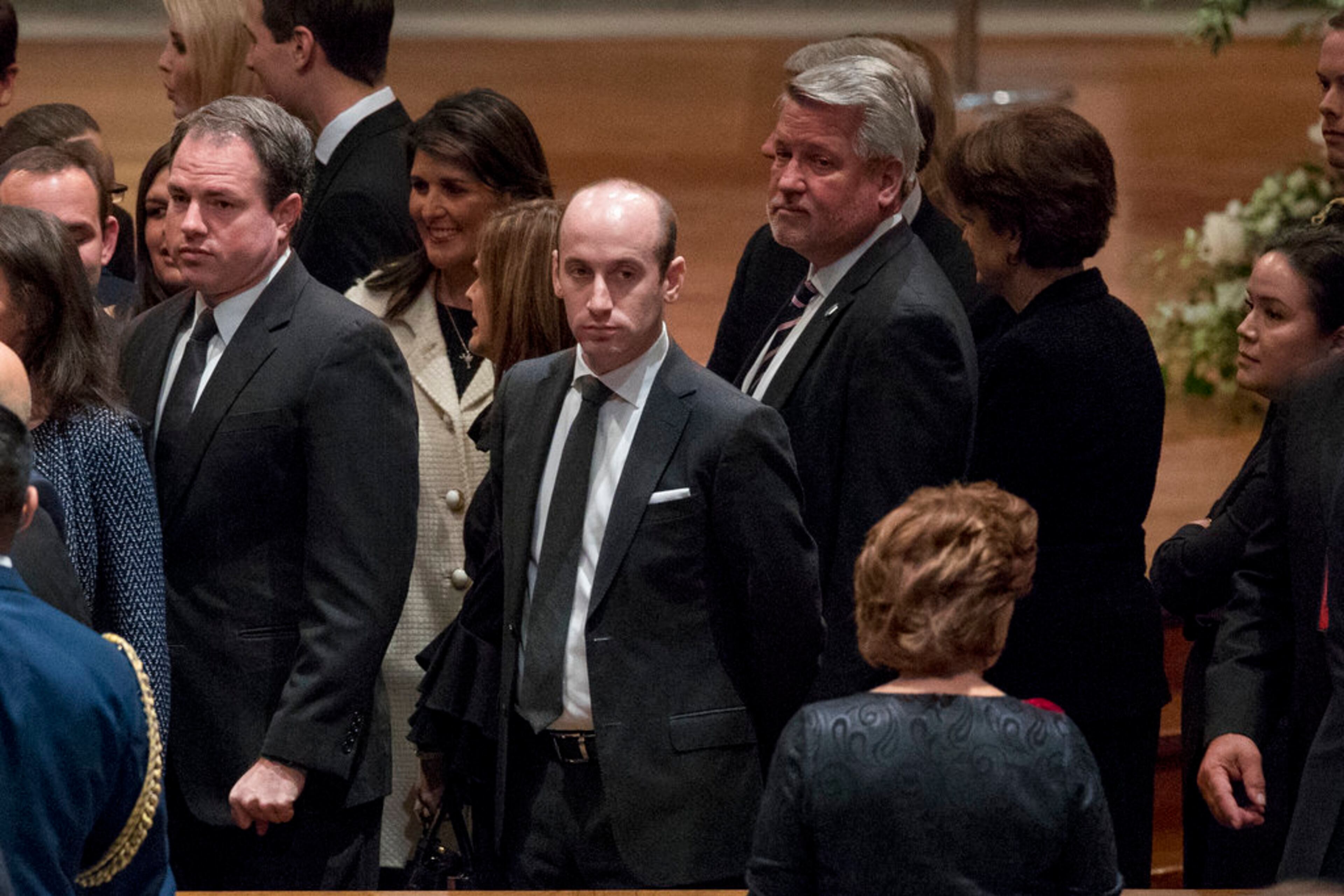 President Donald Trump's White House senior adviser Stephen Miller, center, and White House deputy chief of staff for communications Bill Shine, center right, arrives for a State Funeral for former President George H.W. Bush at the National Cathedral, Wednesday, Dec. 5, 2018, in Washington. (AP Photo/Andrew Harnik, Pool)