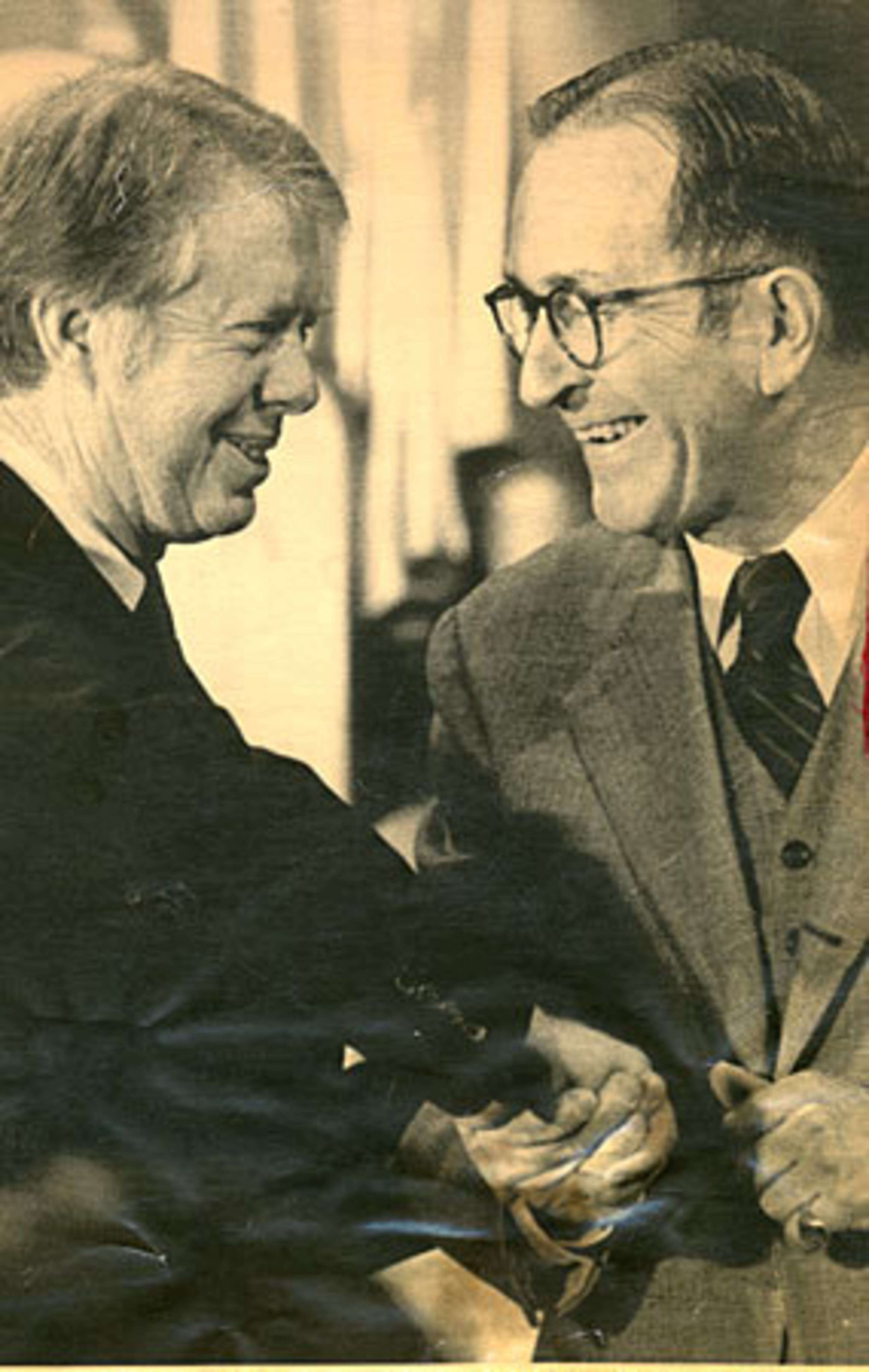 The icy relations between Bell and others in the Carter administration may indirectly have helped Bell achieve what has been described as his greatest accomplishment as attorney general: restoring confidence in the integrity of the Justice Department after the Watergate era. Here, Carter congratulates Bell on his 1977 appointment.