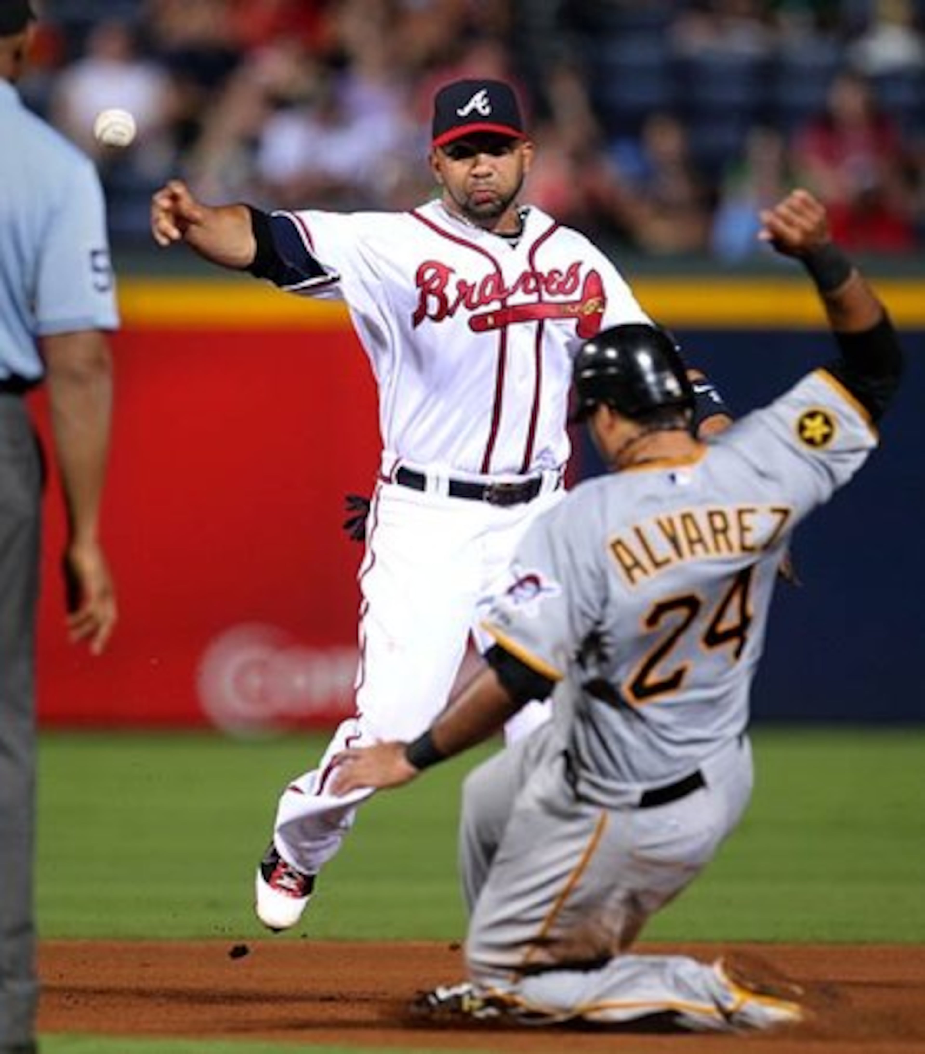 And in the fourth inning, Gonzalez again throws to first base for the double play as Pittsburgh's Pedro Alvarez slides into second.