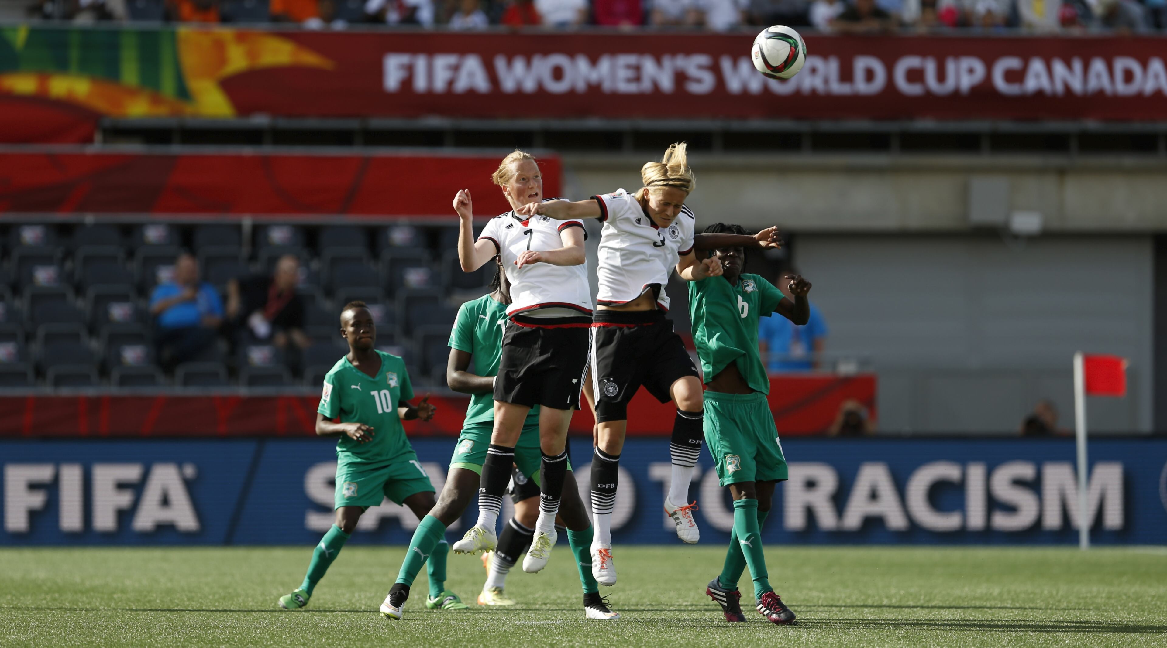 OTTAWA, ON - JUNE 07: Melanie Behringer and Saskia Bartusiak of Germany win a header during the FIFA Women's World Cup 2015 Group B match between Germany and Cote D'Ivoire at Lansdowne Stadium on June 7, 2015 in Ottawa, Canada. (Photo by Steve Bardens-FIFA/FIFA via Getty Images)