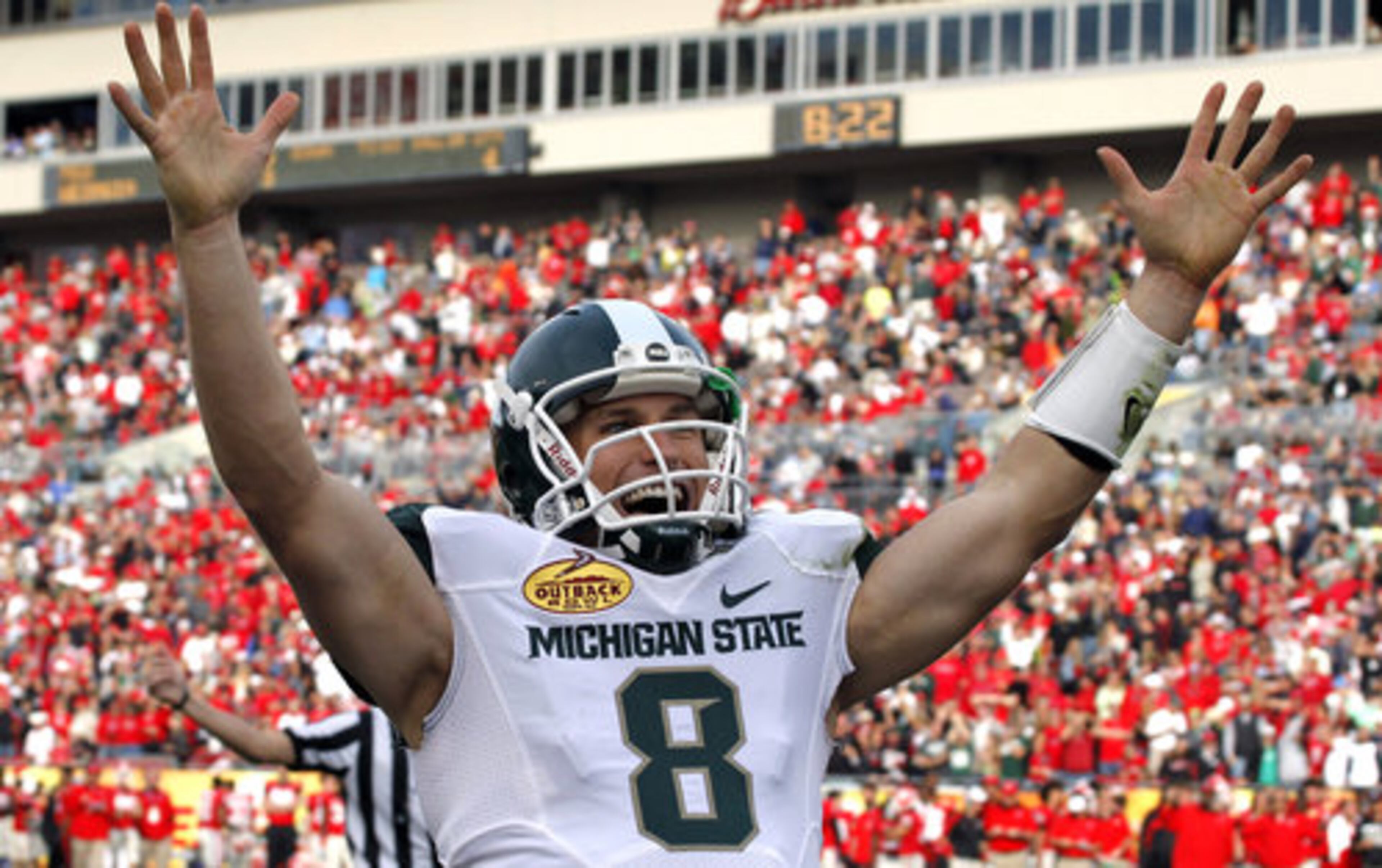 Michigan State quarterback Kirk Cousins celebrates his fourth-quarter touchdown pass to wide receiver Keith Nichol.