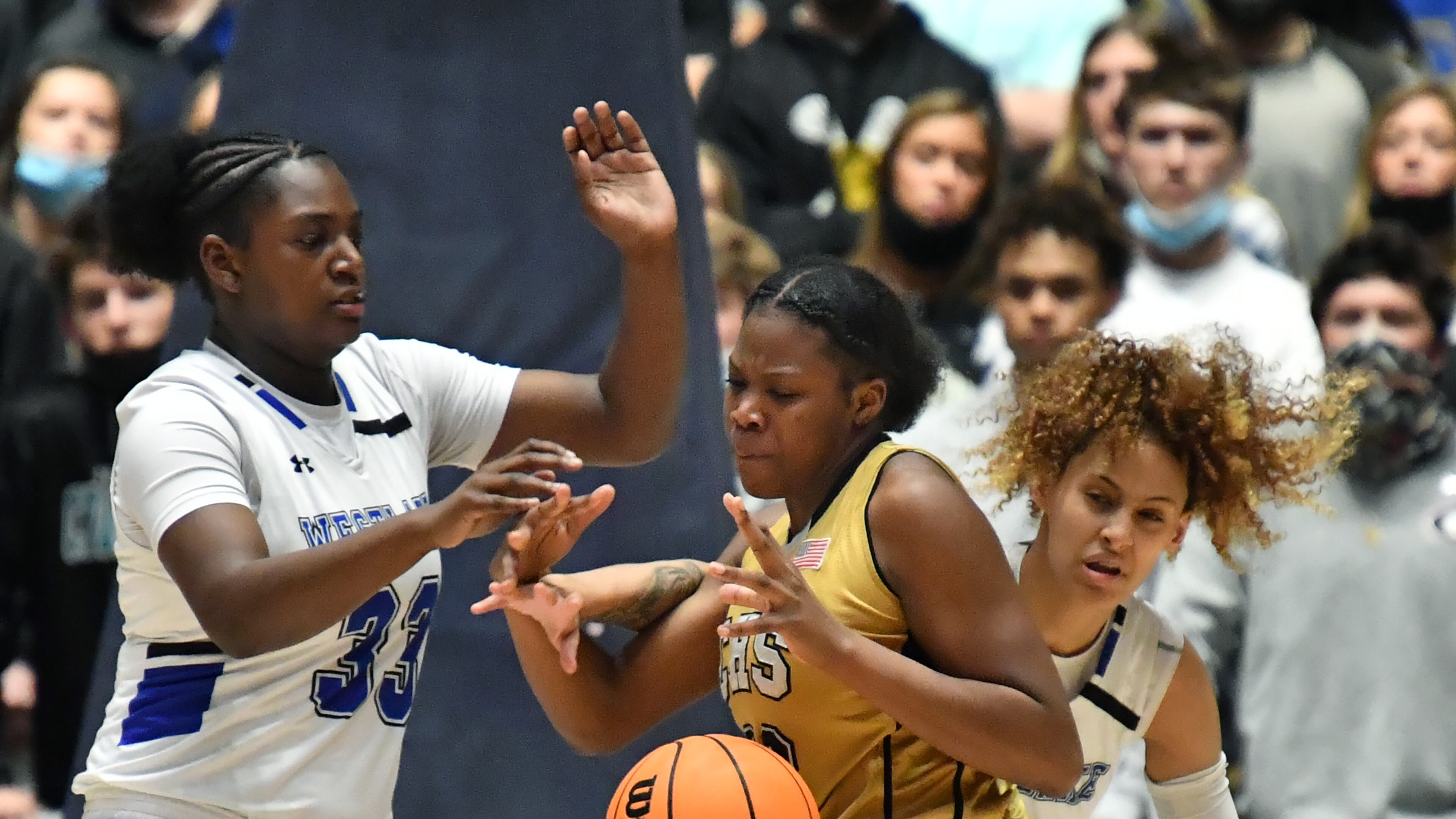 March 12, 2021 Macon - Carrollton's Jenee Edwards (32) fights for the ball with Westlake's Faith Bryant (32) and Westlake's Brianna Turnage (right) during the 2021 GHSA State Basketball Class AAAAAA Girls Championship game at the Macon Centreplex in Macon on Friday, March 12, 2021 Westlake won 64-46 over Carrollton. (Hyosub Shin / Hyosub.Shin@ajc.com)