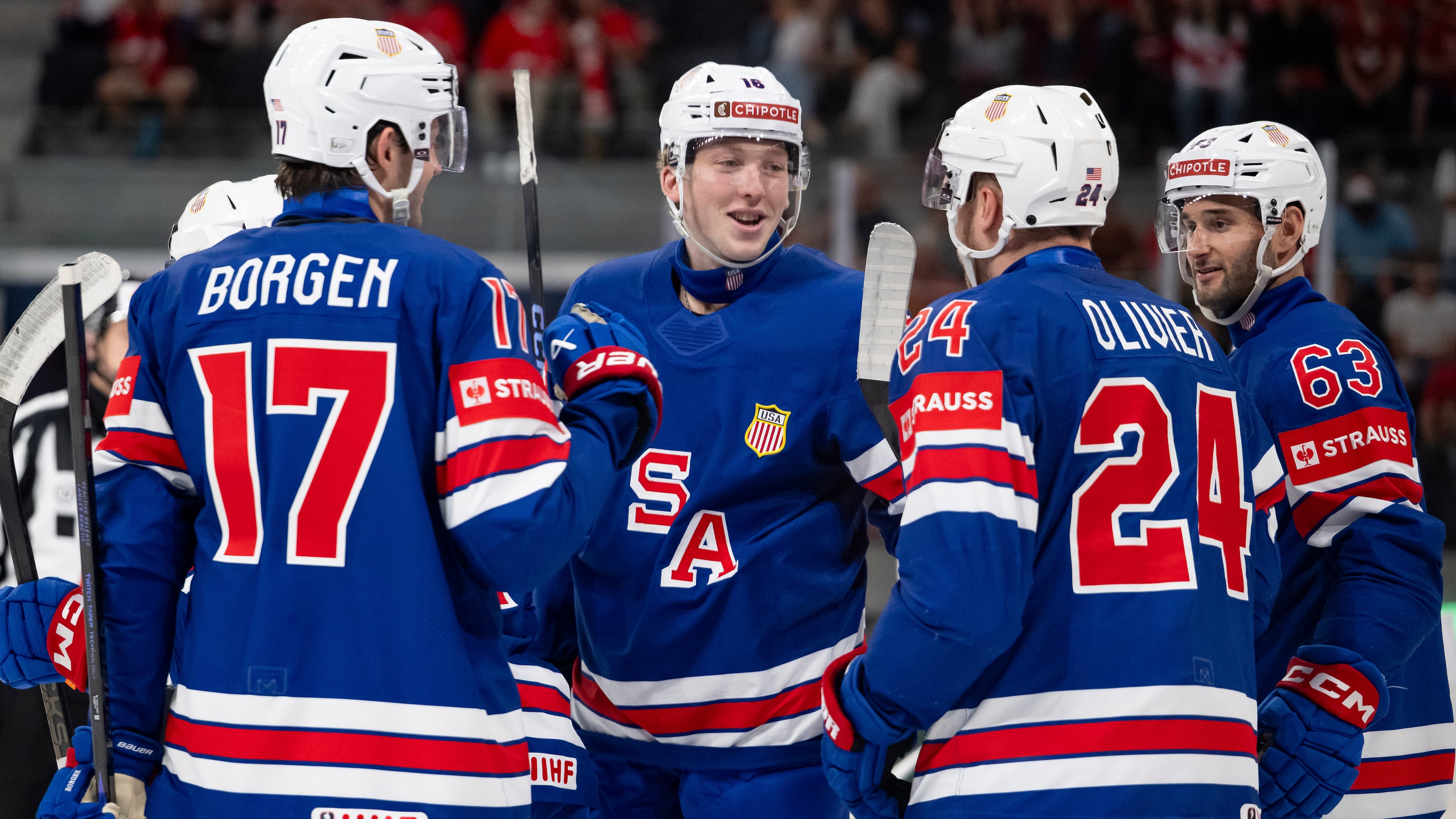 USA's players celebrate their side's third goal during the 2026 IIHF Men's Ice Hockey World Championship preliminary round group A match between United States and Austria in Zurich, Switzerland, Tuesday, May 26, 2026. (Andreas Becker/Keystone via AP)