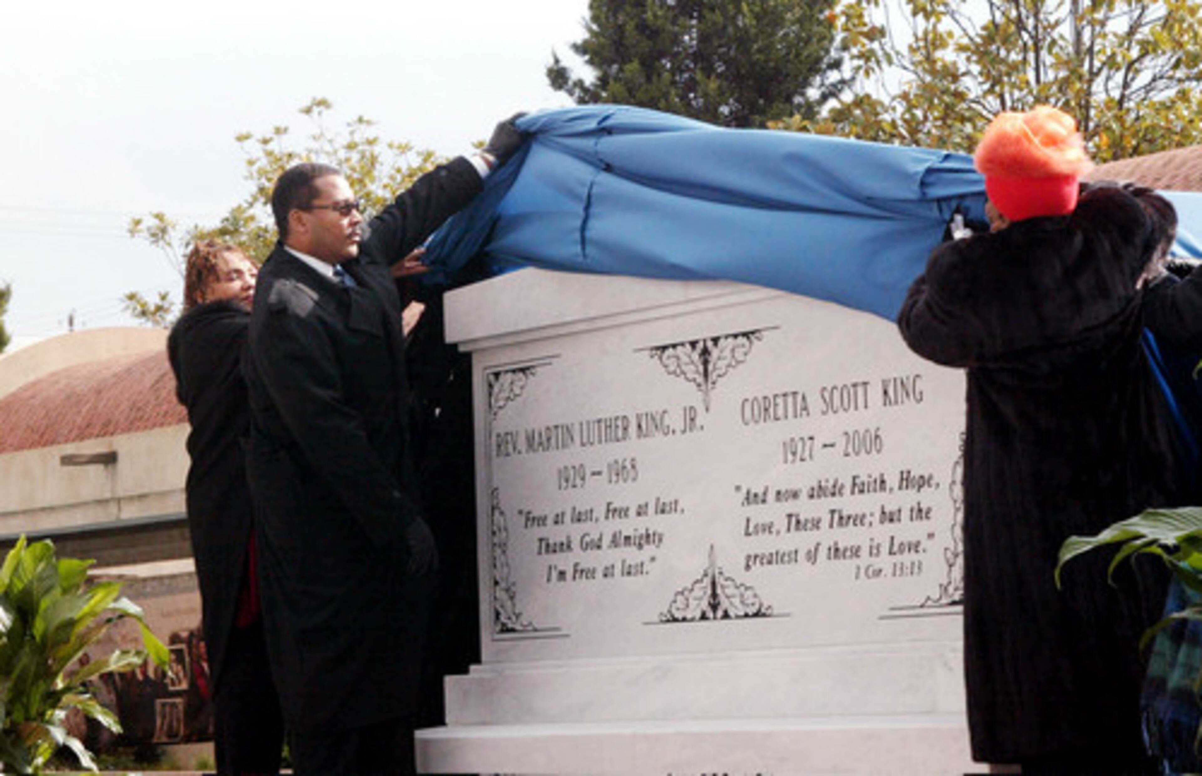 Yolanda King (from left) Dexter King and Christine King Farris unveil the new crypt for their parents, the Rev. Martin Luther King Jr. and Coretta Scott King, at the MLK National Historic site in November 2006.