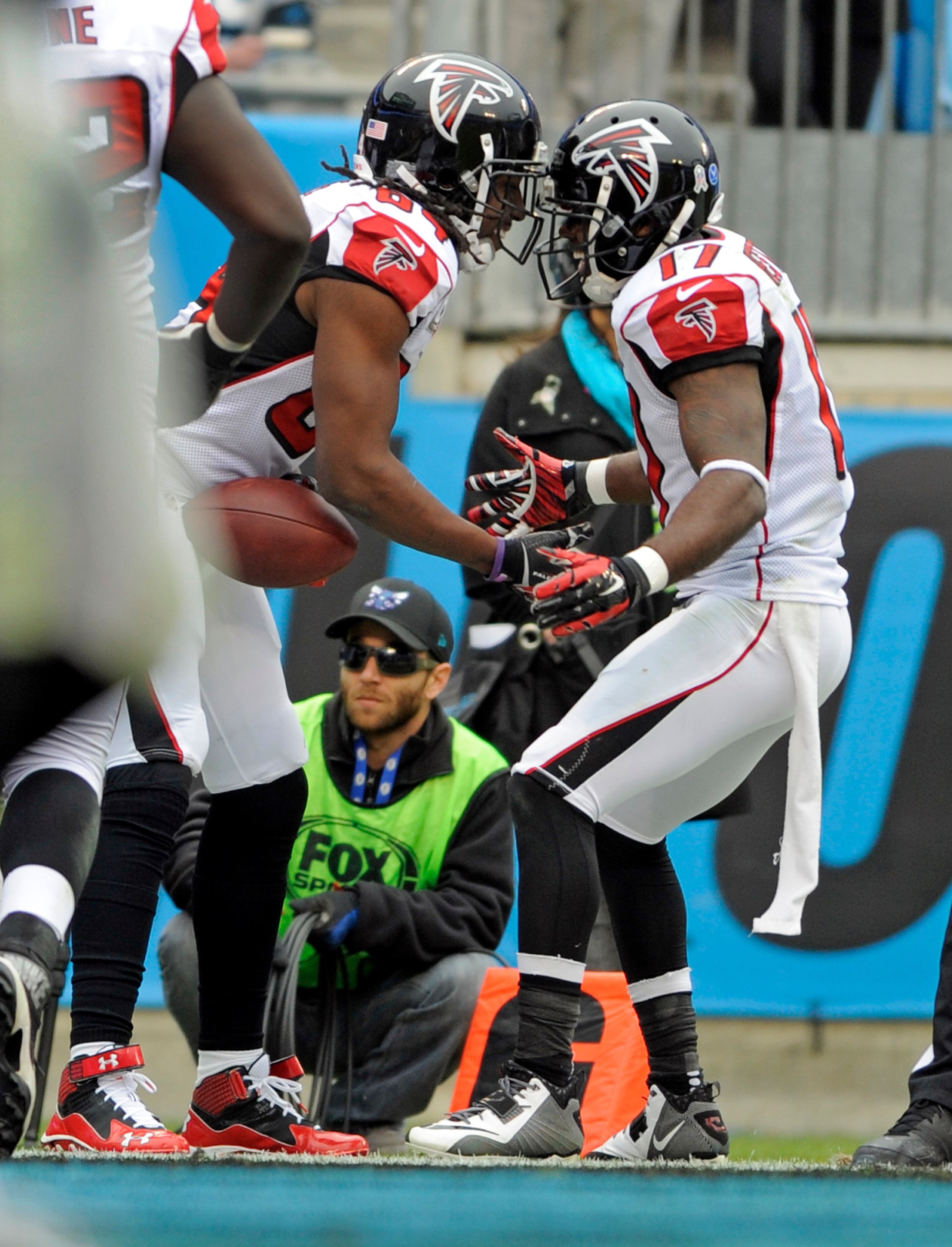 Atlanta Falcons' Roddy White, left, celebrates his touchdown catch against the Carolina Panthers with teammate Devin Hester, right, in the second half of an NFL football game in Charlotte, N.C., Sunday, Nov. 16, 2014. (AP Photo/Mike McCarn)