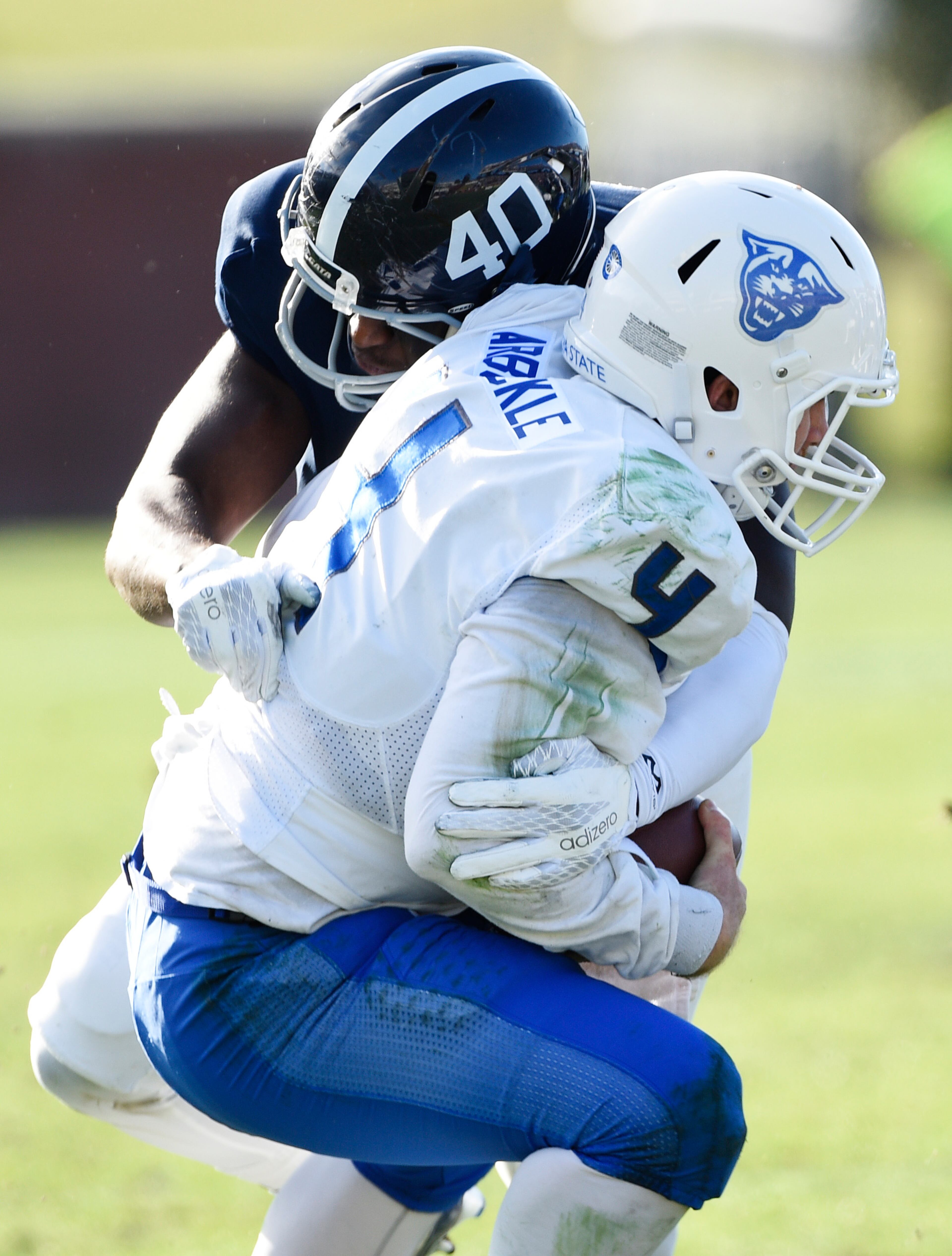 STATESBORO, GA - DECEMBER 5: Defensive end Ryan George #40 of the Georgia Southern Eagles sacks quarterback Nick Arbuckle #4 of the Georgia State Panthers during the second quarter on December 5, 2015 at Paulson Stadium in Statesboro, Georgia. (Photo by Todd Bennett/Getty Images)