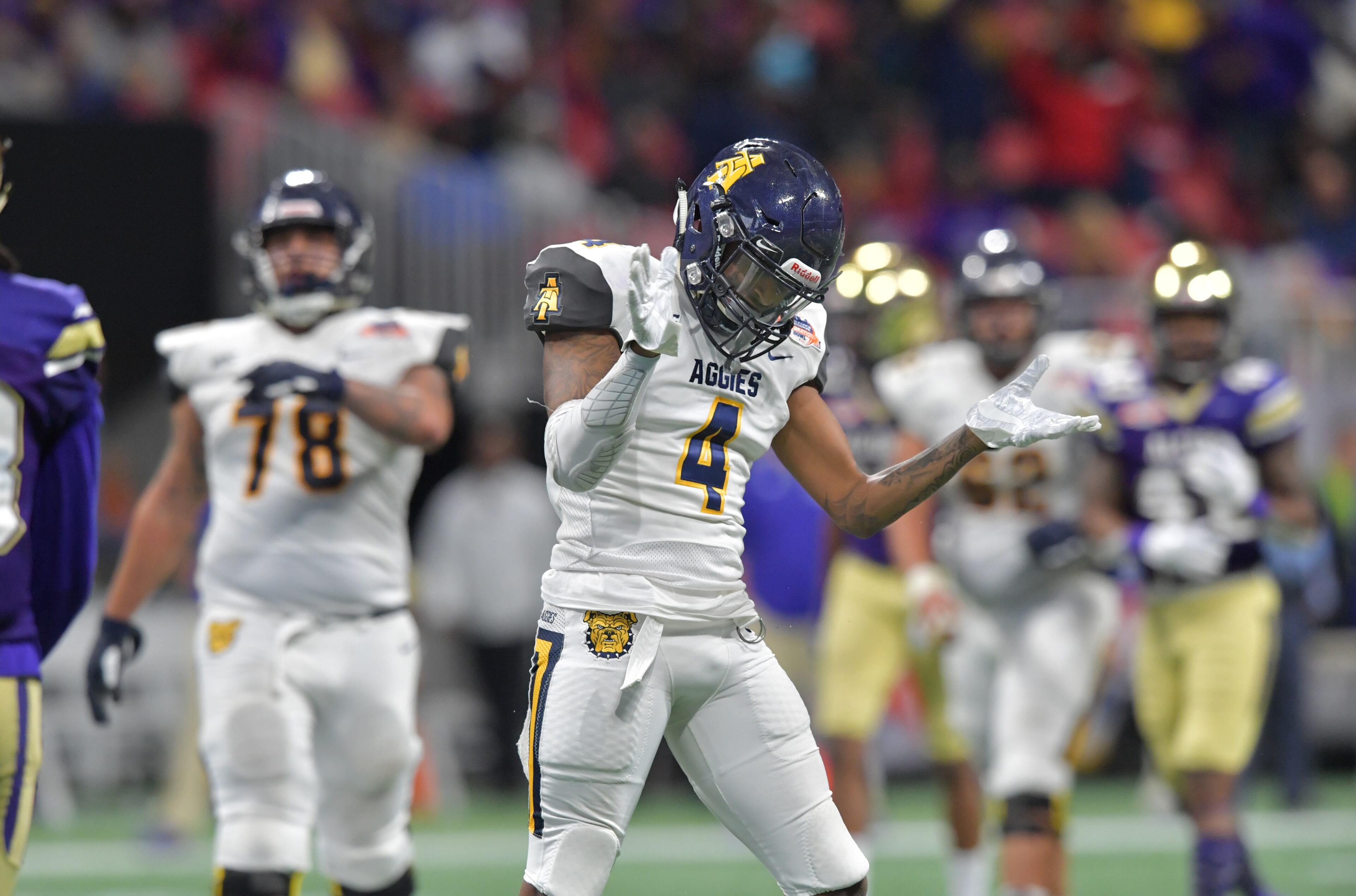 December 15, 2018 Atlanta - North Carolina A&T wide receiver Isaiah Hicklin (4) celebrates during the second half of the 2018 Celebration Bowl at Mercedes-Benz Stadium on Saturday, December 15, 2018. North Carolina A&T won 24-22 over the Alcorn State. HYOSUB SHIN / HSHIN@AJC.COM