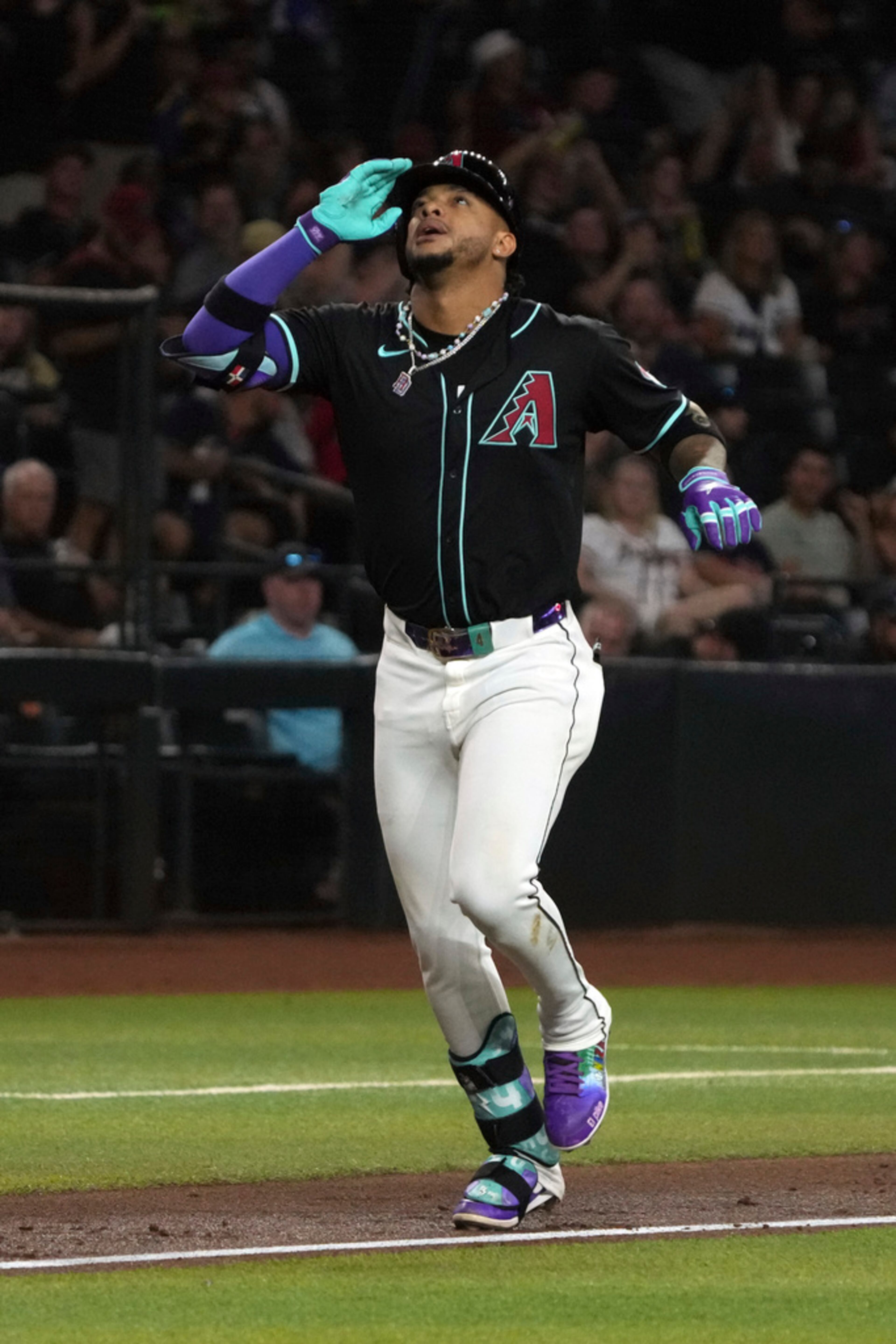 Arizona Diamondbacks' Ketel Marte reacts after hitting a solo home run against the Atlanta Braves in the third inning during a baseball game Wednesday, July 10, 2024, in Phoenix. (AP Photo/Rick Scuteri)