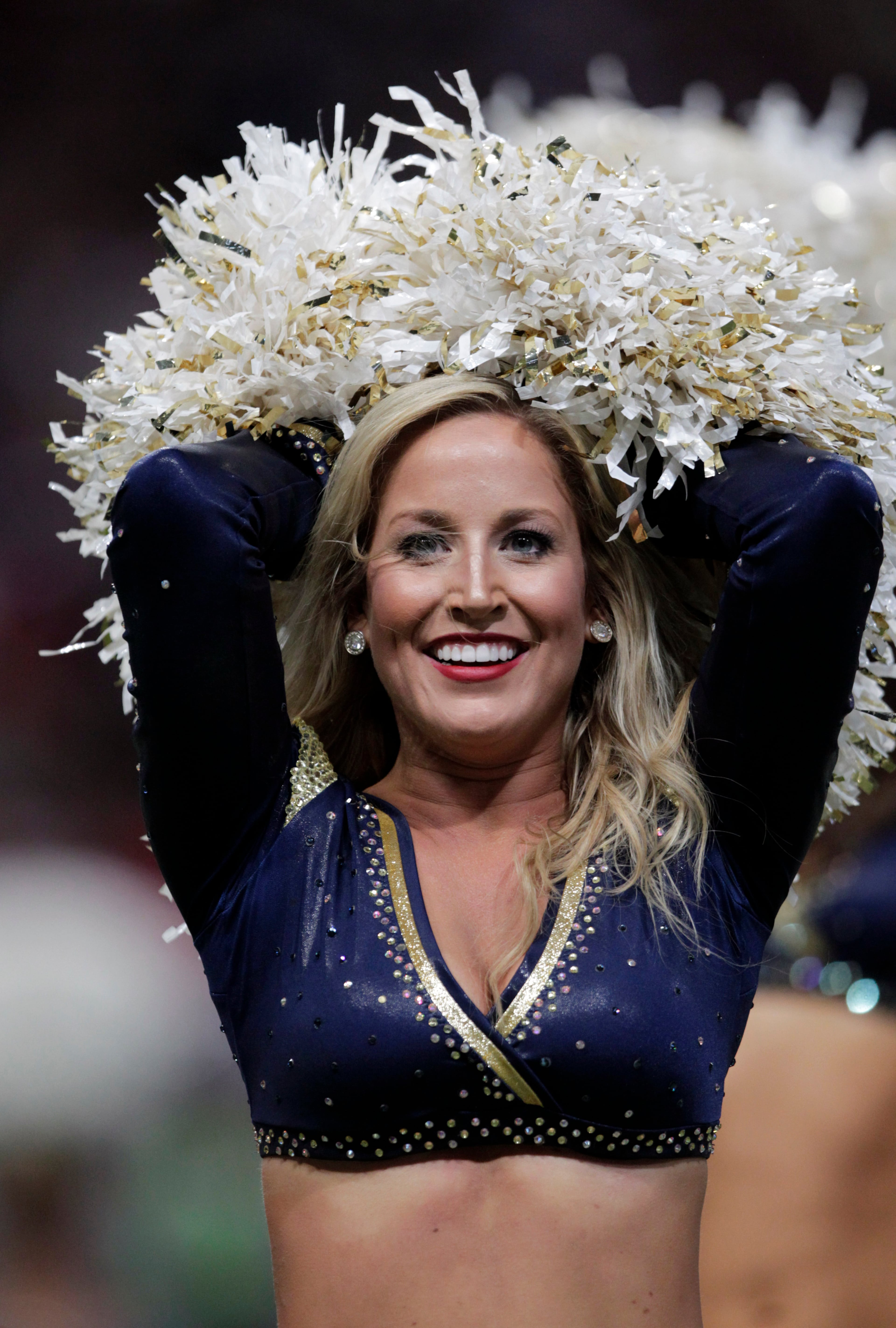 A St. Louis Rams cheerleader performs during the fourth quarter of an NFL football game between the St. Louis Rams and the Dallas Cowboys Sunday, Sept. 21, 2014, in St. Louis. (AP Photo/Tom Gannam)