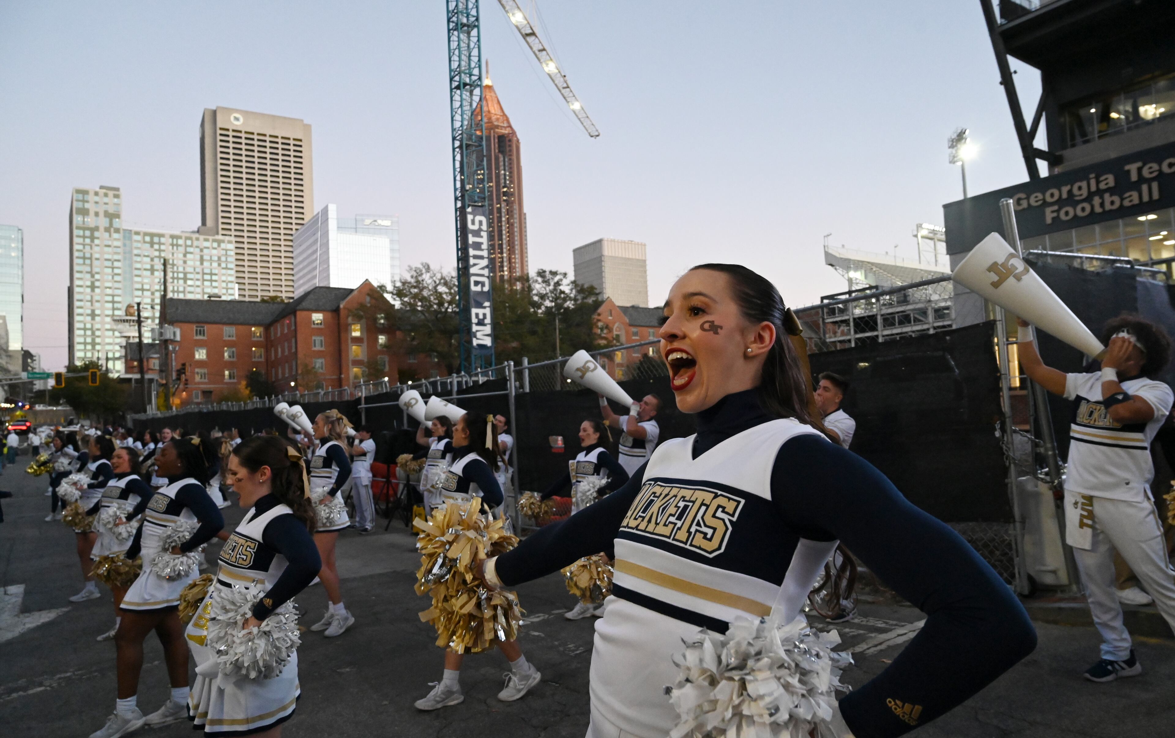 Georgia Tech cheerleaders entertain as players and coaching staff arrive prior to an NCAA college football game between Georgia Tech and North Carolina State at Bobby Dodd Stadium, Thursday, November 21, 2024, in Atlanta. (Hyosub Shin / AJC)