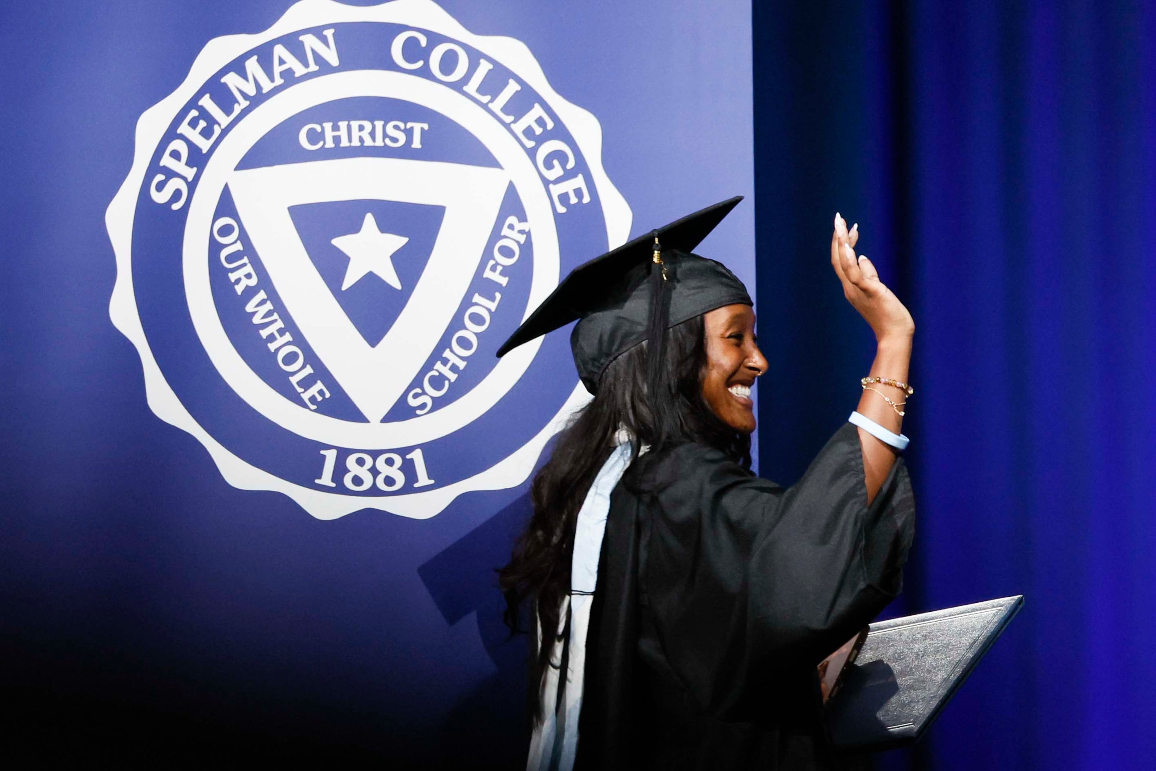 Zahara Marley Jolie-Pitt, the daughter of Angelina Jolie, reacts as she walks off the stage after receiving her diploma during the Spelman College Commencement at the Georgia International Convention Center in College Park on Sunday, May 17, 2026. (Miguel Martinez/AJC)