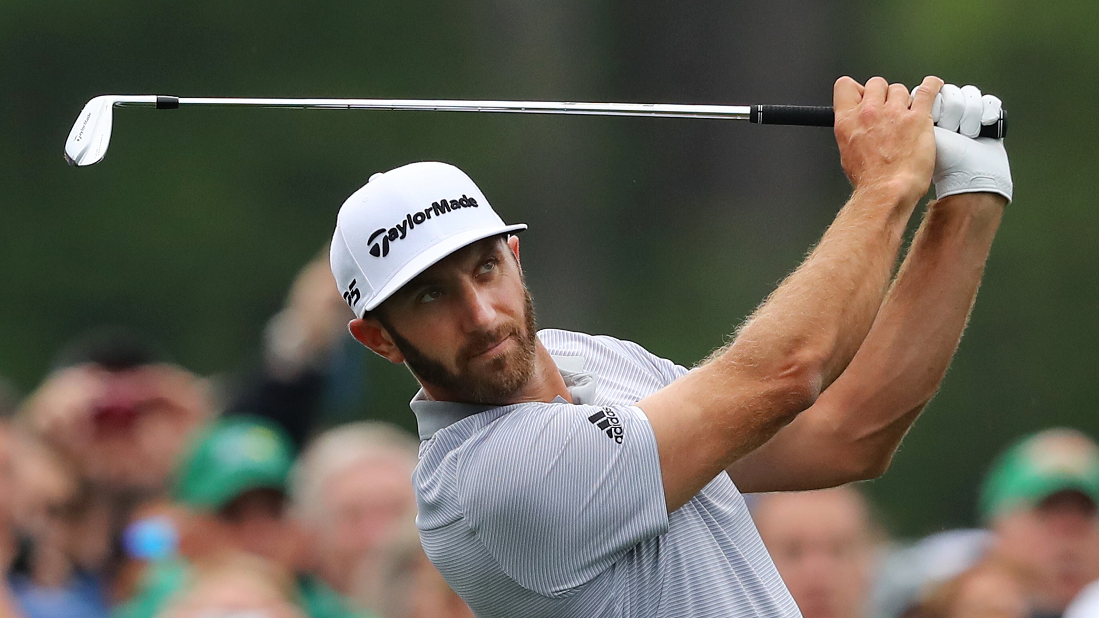 Dustin Johnson tees off on the 12th hole during his practice round for the Masters Wednesday.