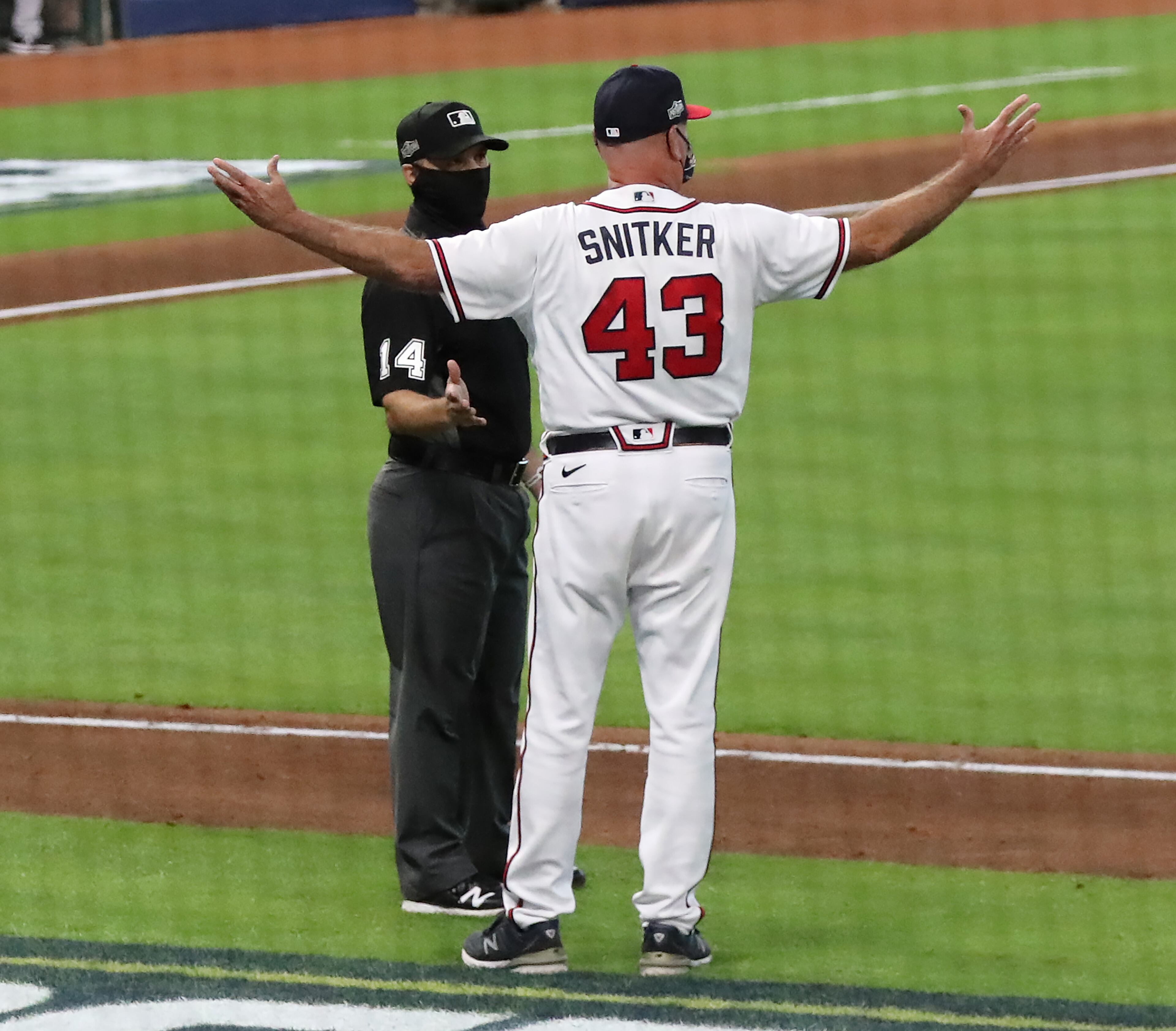 Atlanta Braves manager Brian Snitker argues with umpires after Ronald Acuna was hit by a pitch by Miami Marlins starting pitcher Sandy Alcantara during the third inning in Game 1 of a National League Division Series at Minute Maid Park on Tuesday, Oct 6, 2020 in Houston. “Curtis Compton / Curtis.Compton@ajc.com”