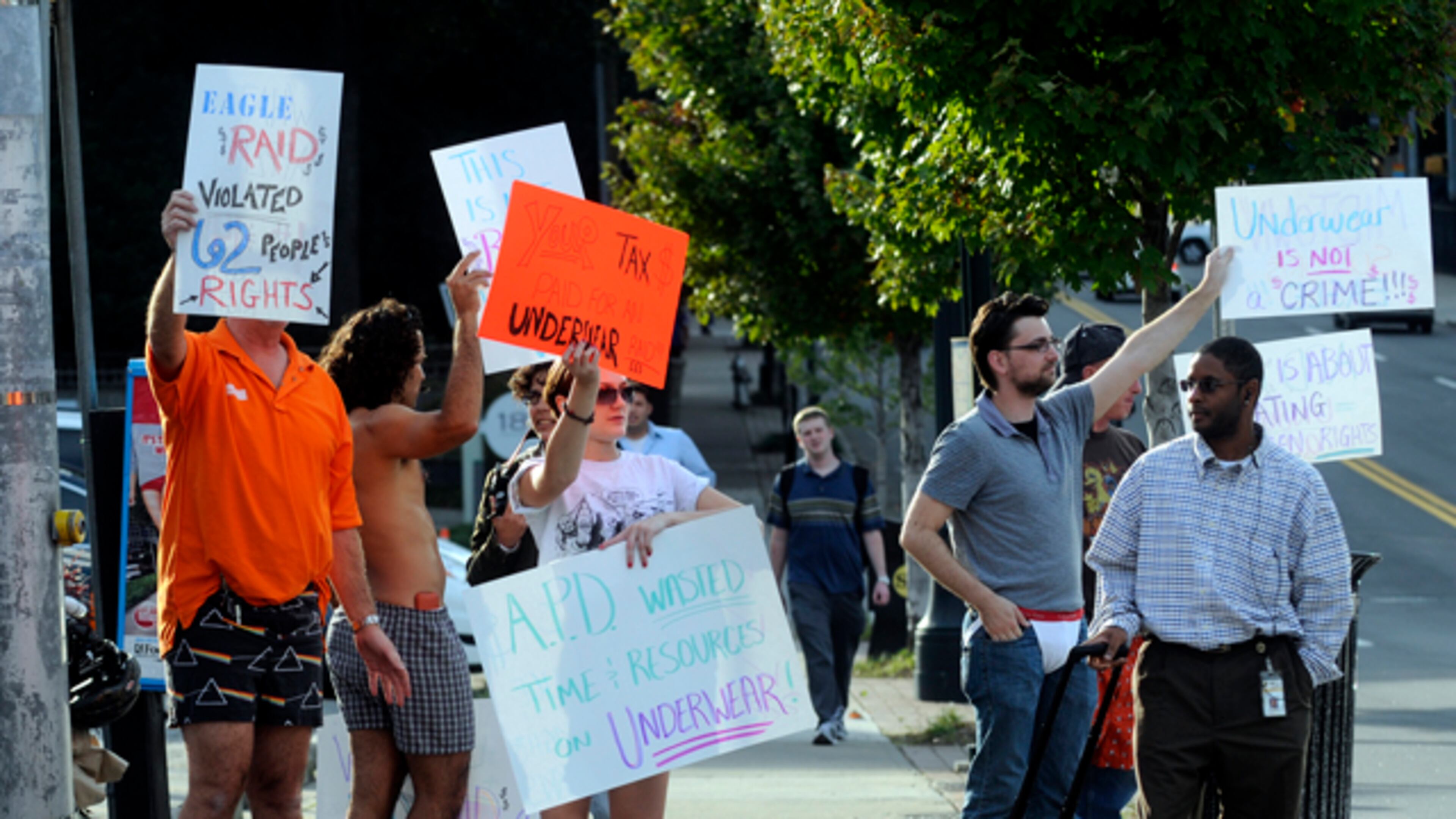 091021 Atlanta--Protesters stand, some in their underwear, at the intersection of 10th Street and Piedmont Avenue in Atlanta, Ga Wednesday, Oct 21, 2009 to make a statement about the recent raids at the Eagle club. "Out of 62 people that were in the bar harassed,we probably have 15 people who have come forward, because they are scared," Robert Kelley, an owner of the Eagle who was also in his underwear, said. "They don't need to be afraid. We didn't do anything wrong, the police did." Elissa Eubanks, eeubanks@ajc.com