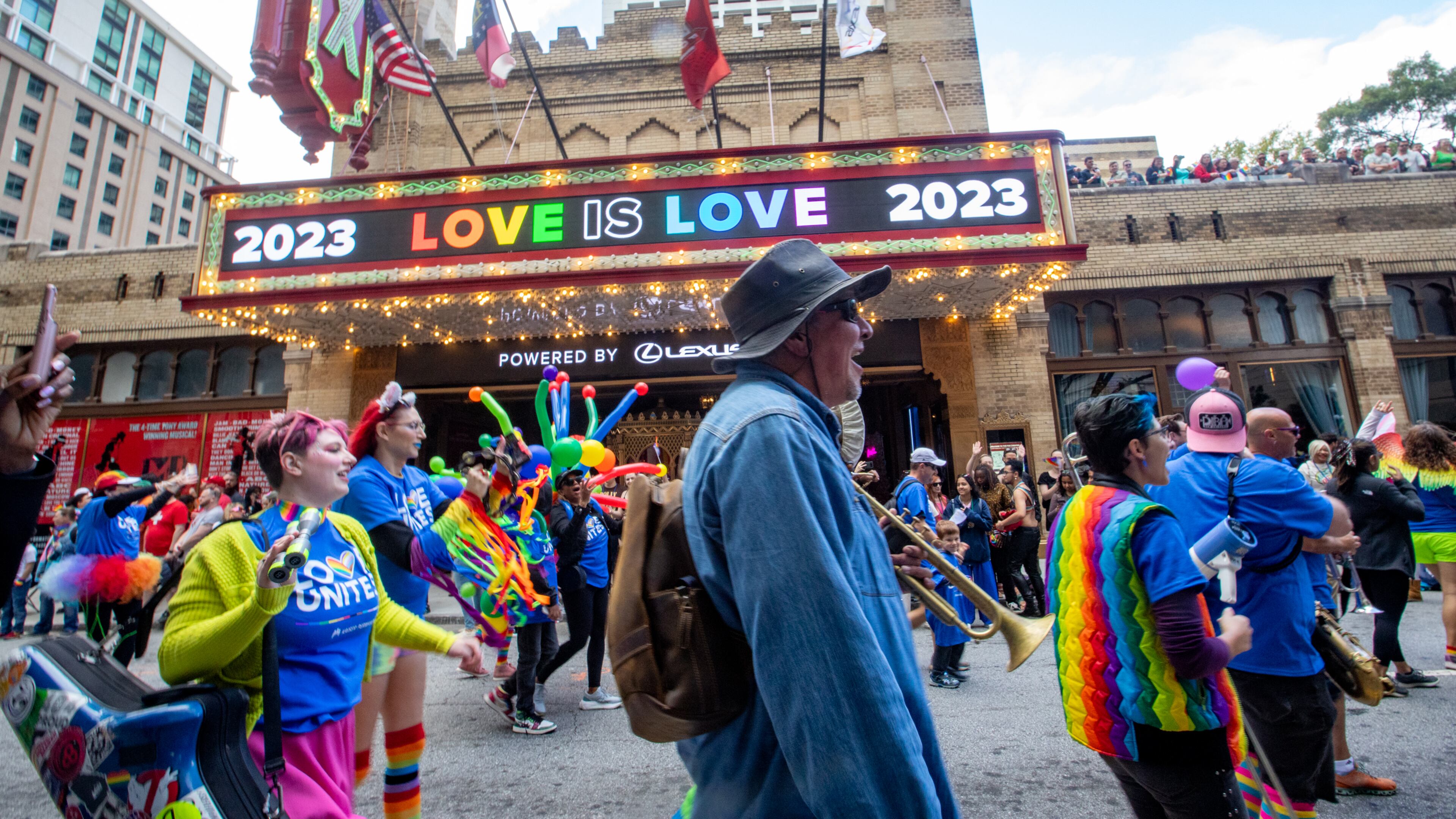 The annual Pride Parade marches up Peachtree Street past the Fox Theater on Sunday, Oct 15, 2023. (Jenni Girtman for The Atlanta Journal-Constitution)