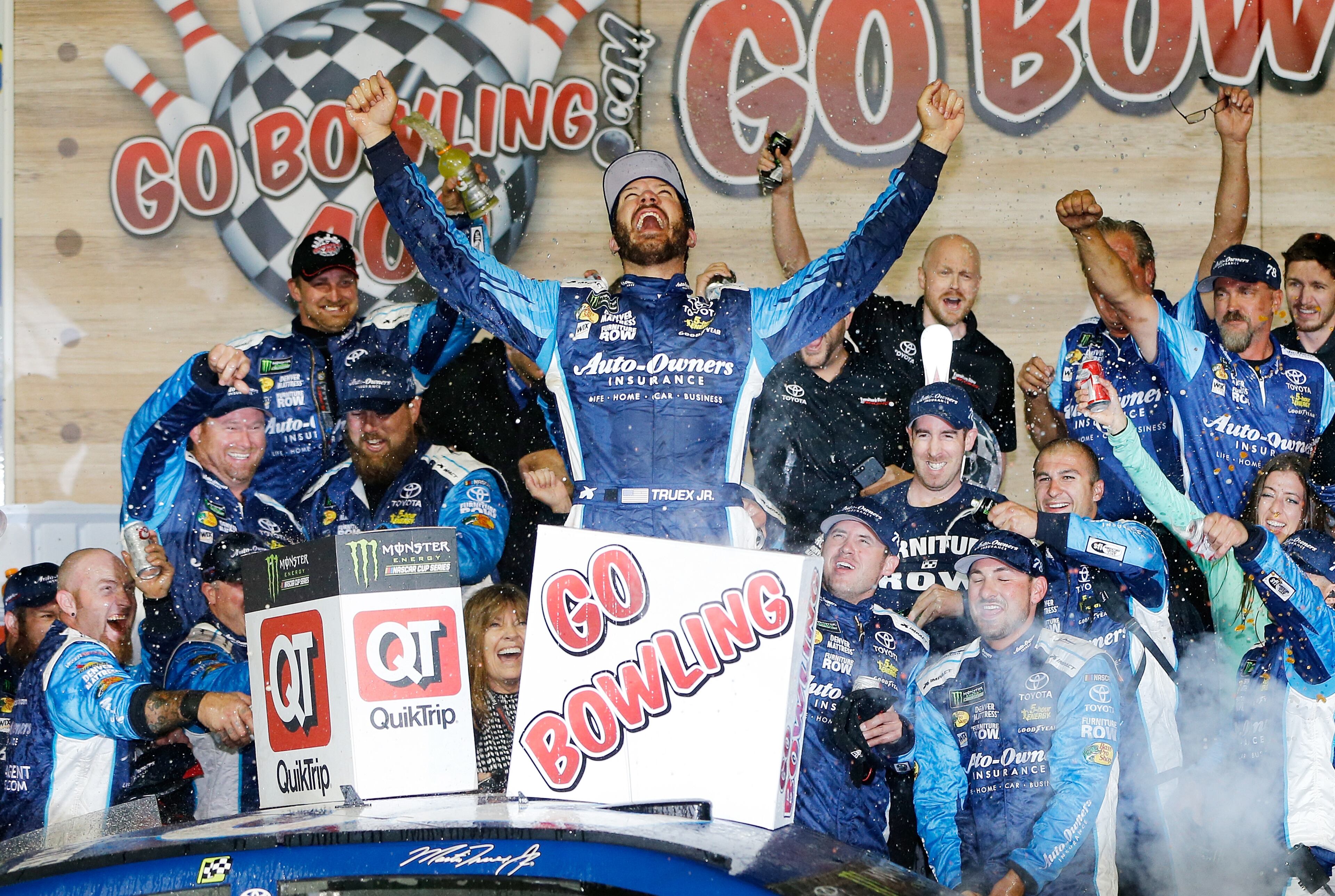 KANSAS CITY, KS - MAY 13: Martin Truex Jr., driver of the #78 Auto-Owners Insurance Toyota, celebrates in Victory Lane after winning the Monster Energy NASCAR Cup Series Go Bowling 400 at Kansas Speedway on May 13, 2017 in Kansas City, Kansas. (Photo by Jonathan Ferrey/Getty Images)