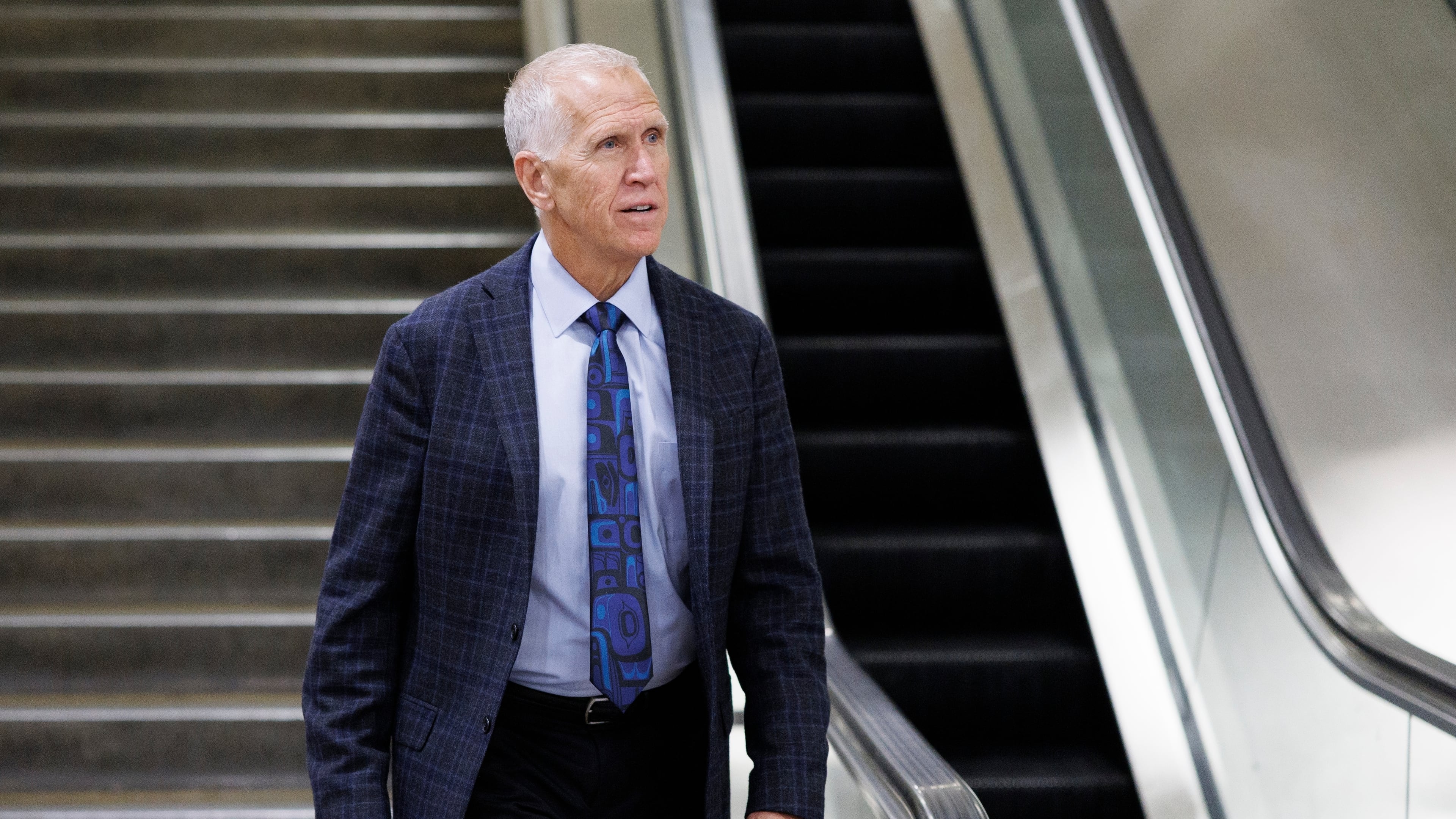 Sen. Thom Tillis, R-N.C., descends an stairwell after a vote at the Capitol, Friday, March 20, 2026, in Washington. (AP Photo/Tom Brenner)