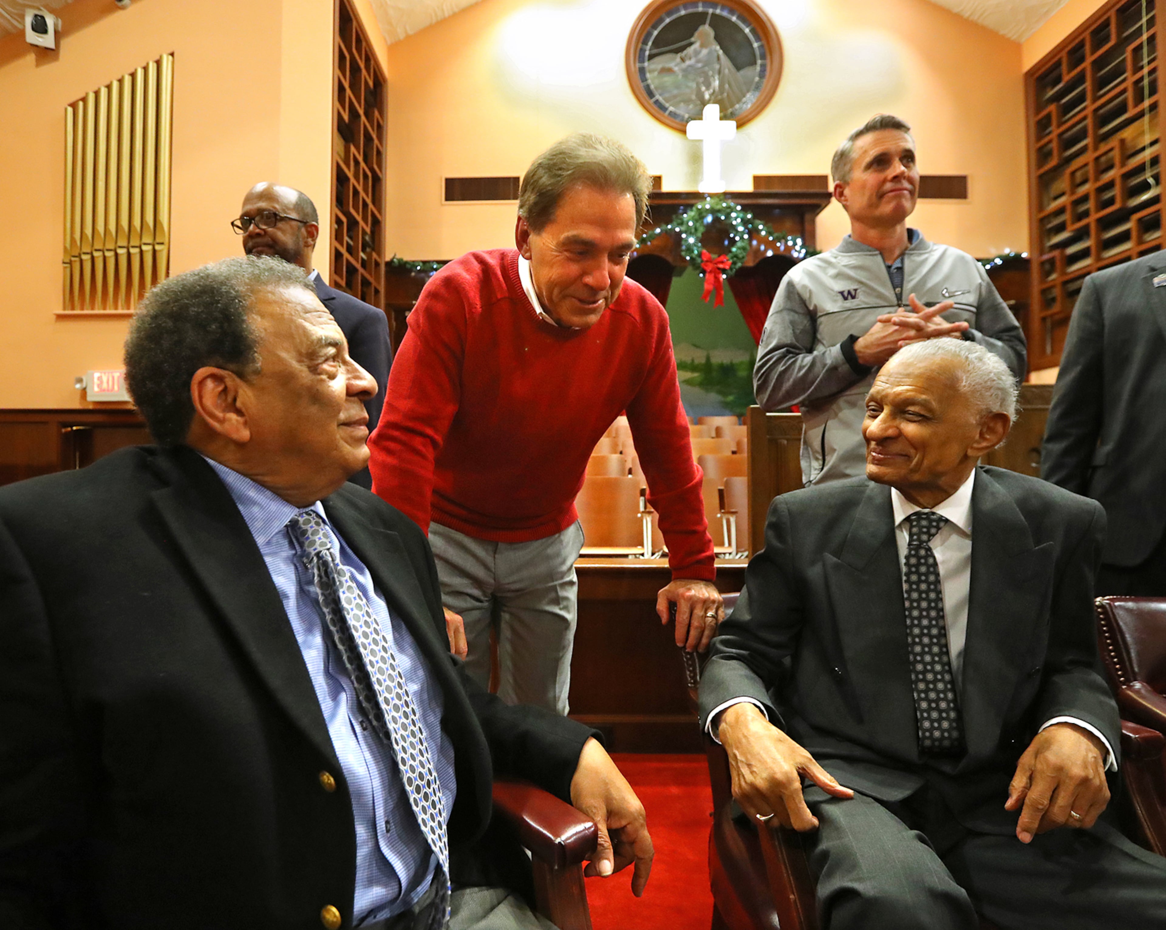 December 27, 2016, Atlanta: Alabama head football coach Nick Saban and Washington head football coach Chris Petersen greet Ambassador Andrew Young (seated left) and Dr. C.T. Vivian at the conclusion of a Chick-fil-A Peach Bowl tour of the Martin Luther King Jr. National Historic Site to hear first-hand accounts from Civil Rights leaders at the Historic Ebenezer First Baptist Church on Tuesday, Dec. 27, 2016, in Atlanta. For more about the Chick-fil-A Peach Bowl, turn to Sports, Page C1. Curtis Compton/ccompton@ajc.com