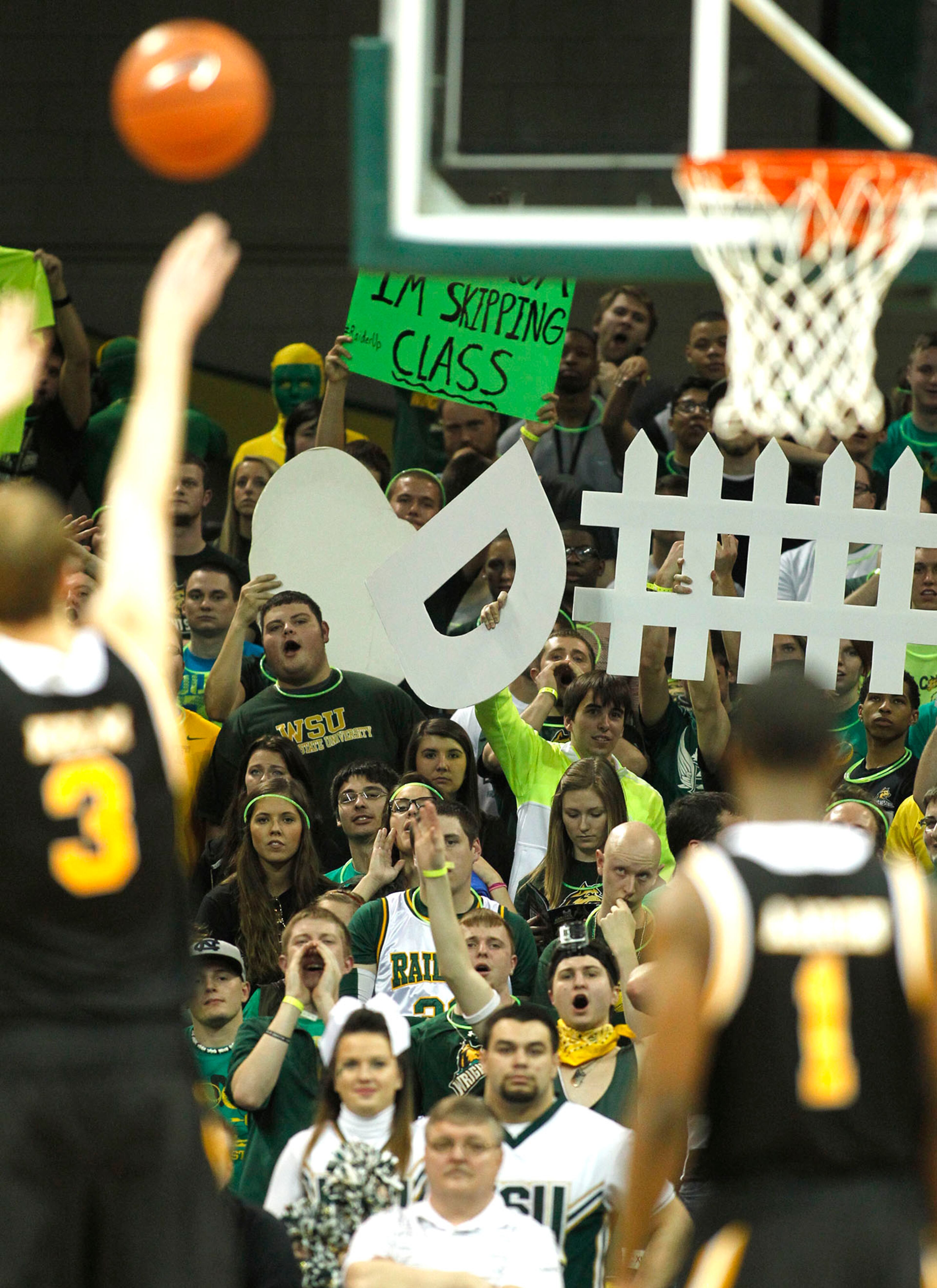 Wright State Fans had a variety of faces to help cheer on their team as the Raiders hosted the Panthers for the Horizon League Championship. TY GREENLEES / STAFF