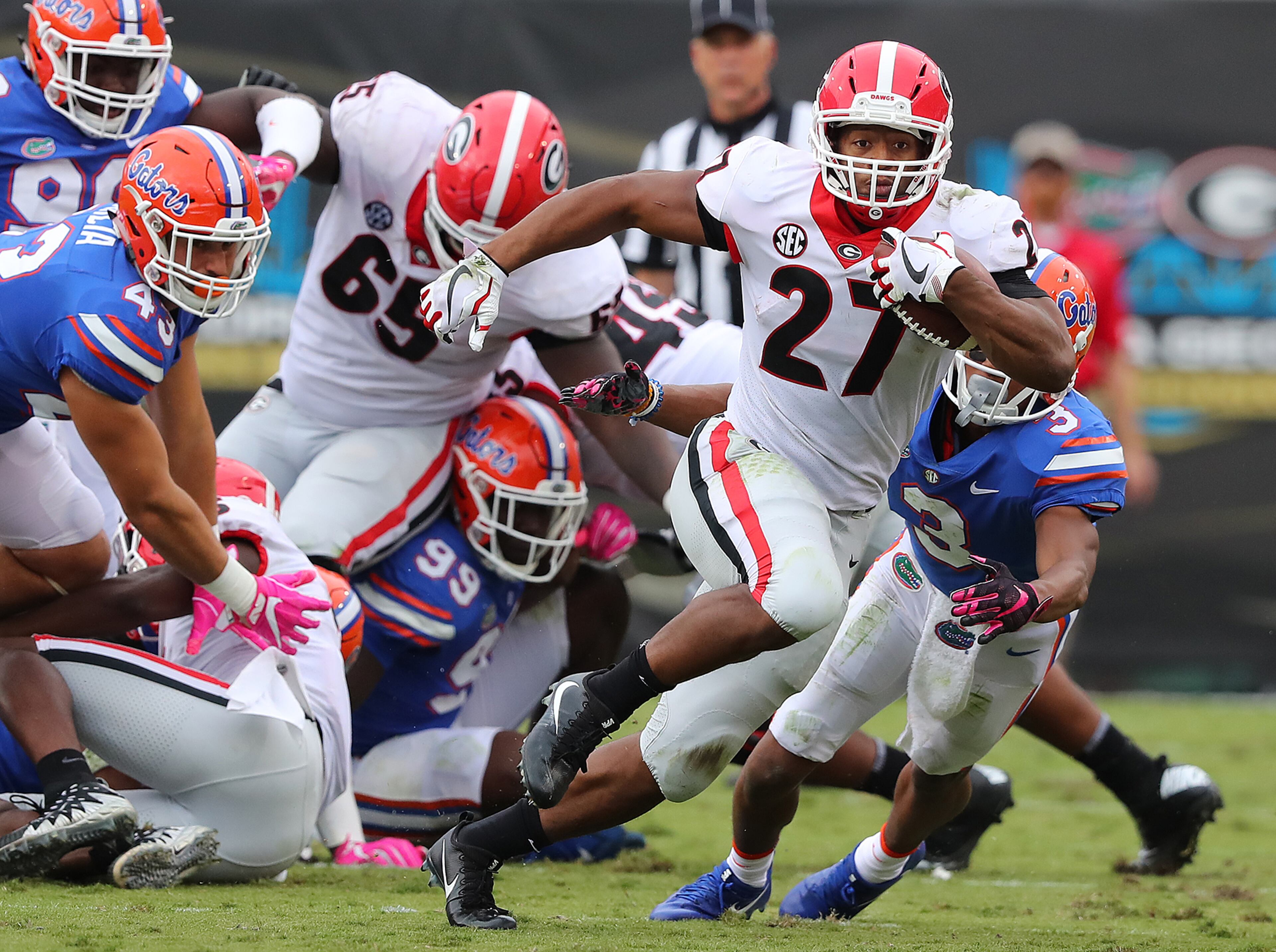 October 28, 2017 Jacksonville: Georgia tailback Nick Chubb breaks away for a first down against Florida during the first half in a NCAA college football game on Friday, October 27, 2017, in Jacksonville. Curtis Compton/ccompton@ajc.com