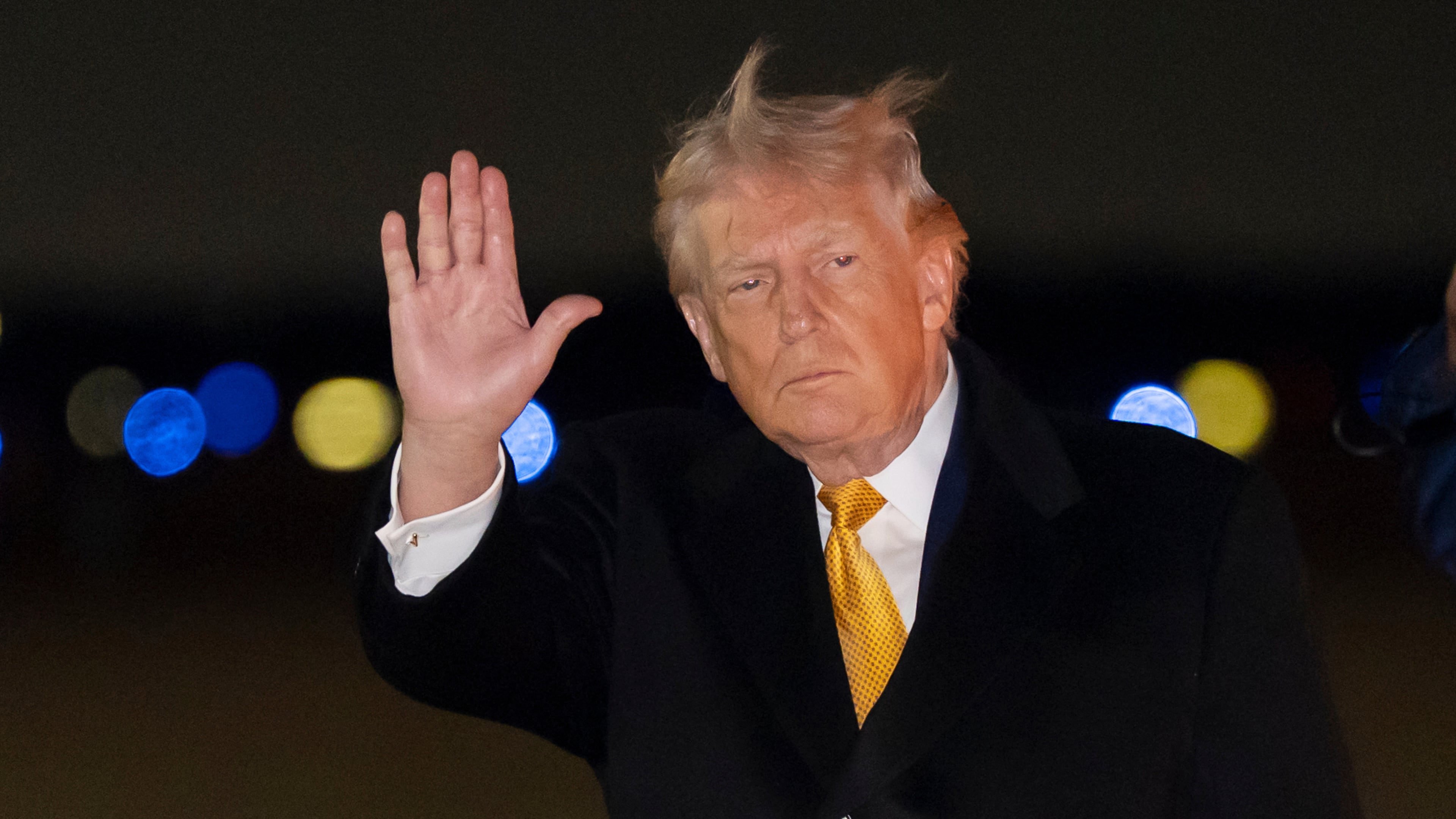 President Donald Trump waves as he arrives on Air Force One, Sunday, Jan. 4, 2026, at Joint Base Andrews, Md. (AP Photo/Alex Brandon)