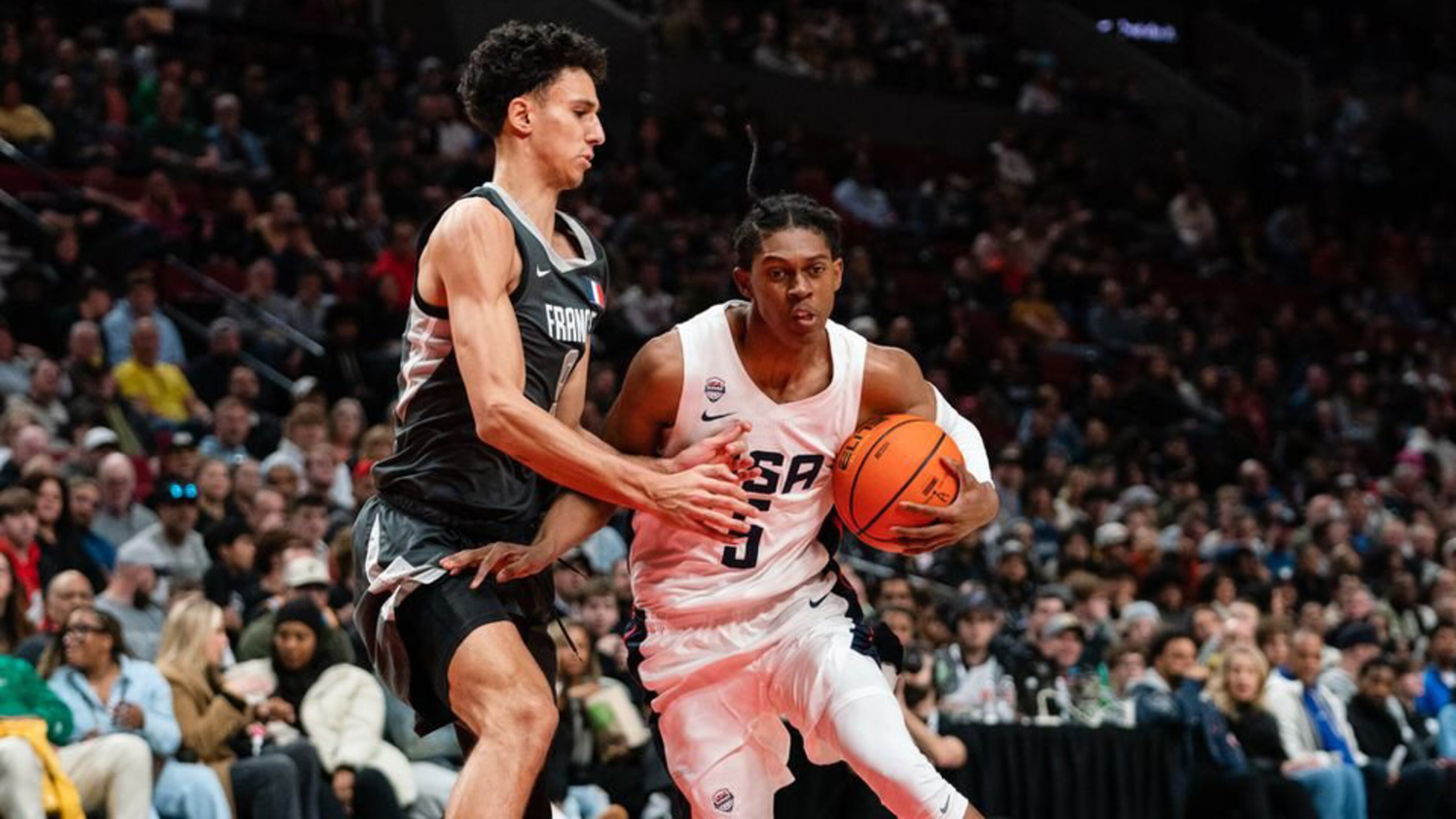 Cody Williams of Team USA (R) dribbles past Zaccharie Risacher of World Team (L) during the Nike Hoop Summit at the Moda Center on Saturday, April 8, 2023 in Portland, Ore. The USA Team went on to win 90-84 over the World Team. (Photo by Ali Gradischer for The Oregonian/OregonLive)