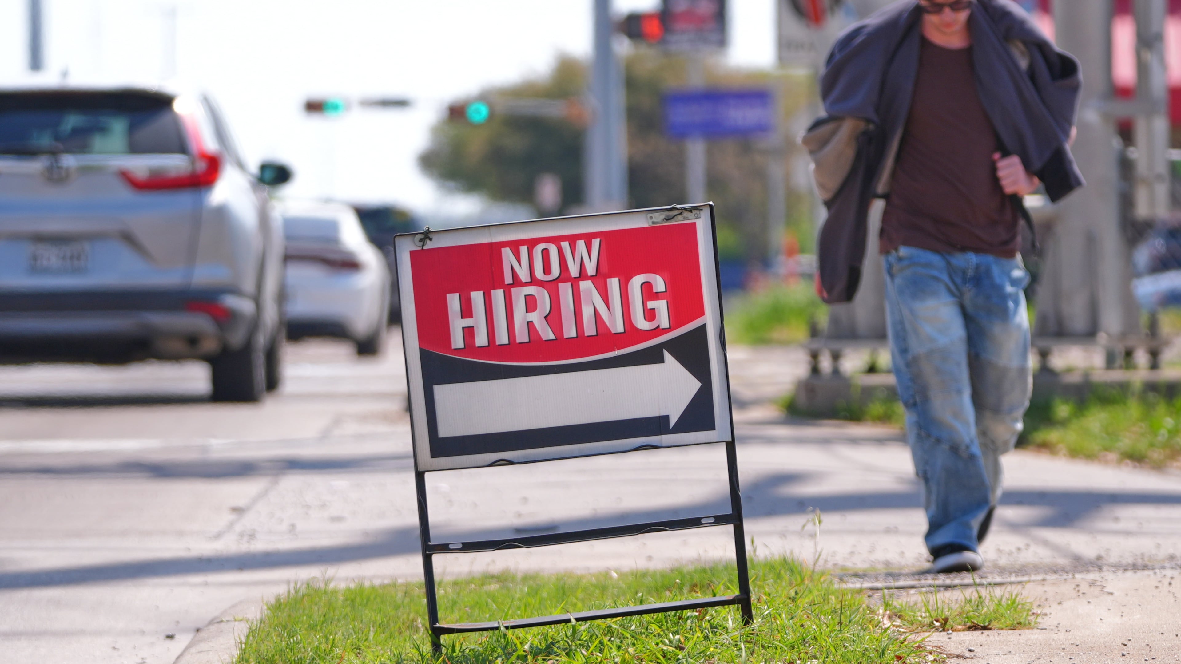 A now hiring sign sits on the side of the road in Garland, Texas, Monday, March 23, 2026. (AP Photo/LM Otero)