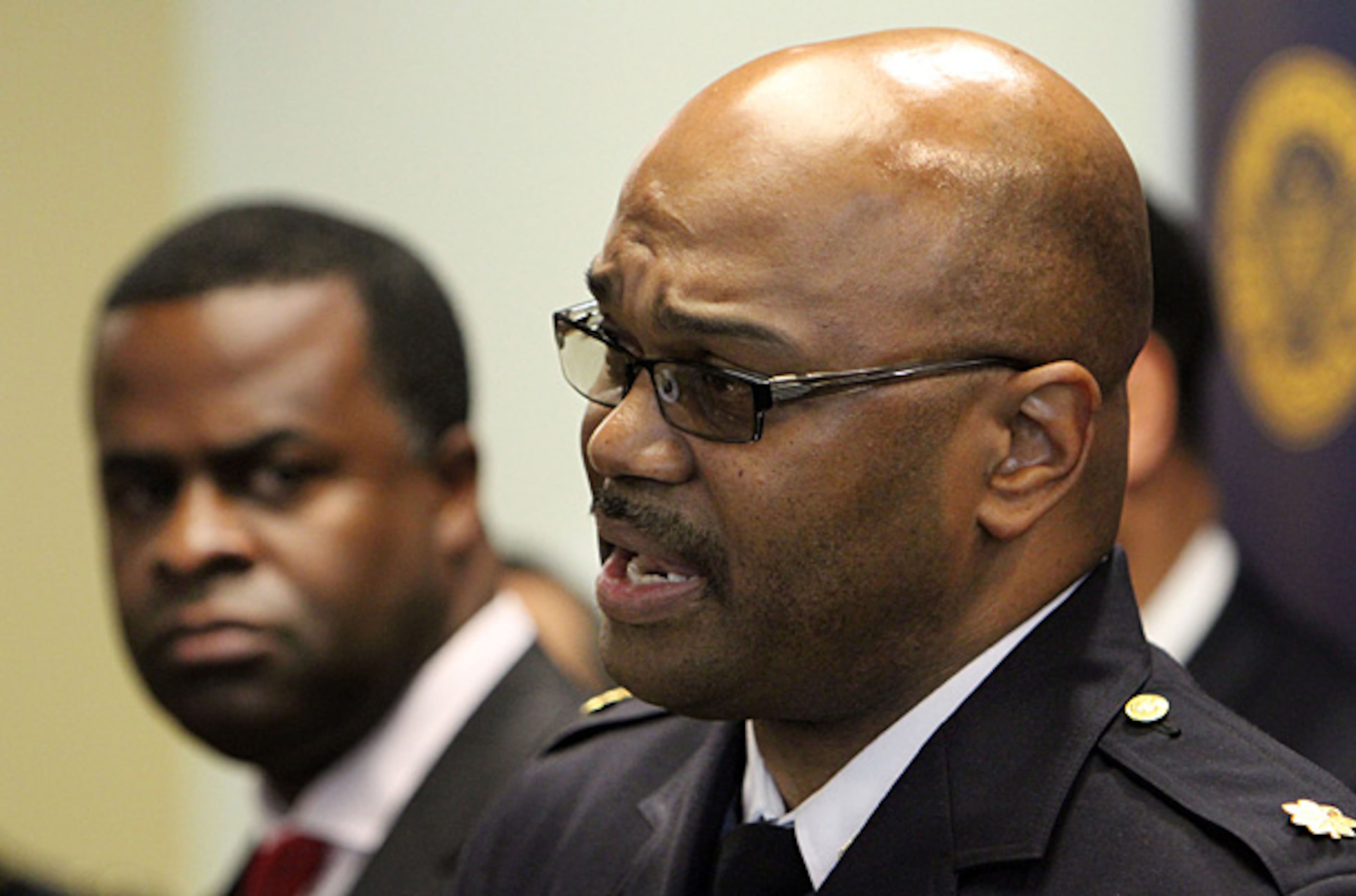 Atlanta Mayor Kasim Reed (background) listens on Dec. 22, 2010, as Atlanta Police Major Keith Meadows announces that Tamario Wise, 18, and two others have been the charged with the murder of Charles Boyer, who was killed on Nov. 22 at 609 Virginia Ave.