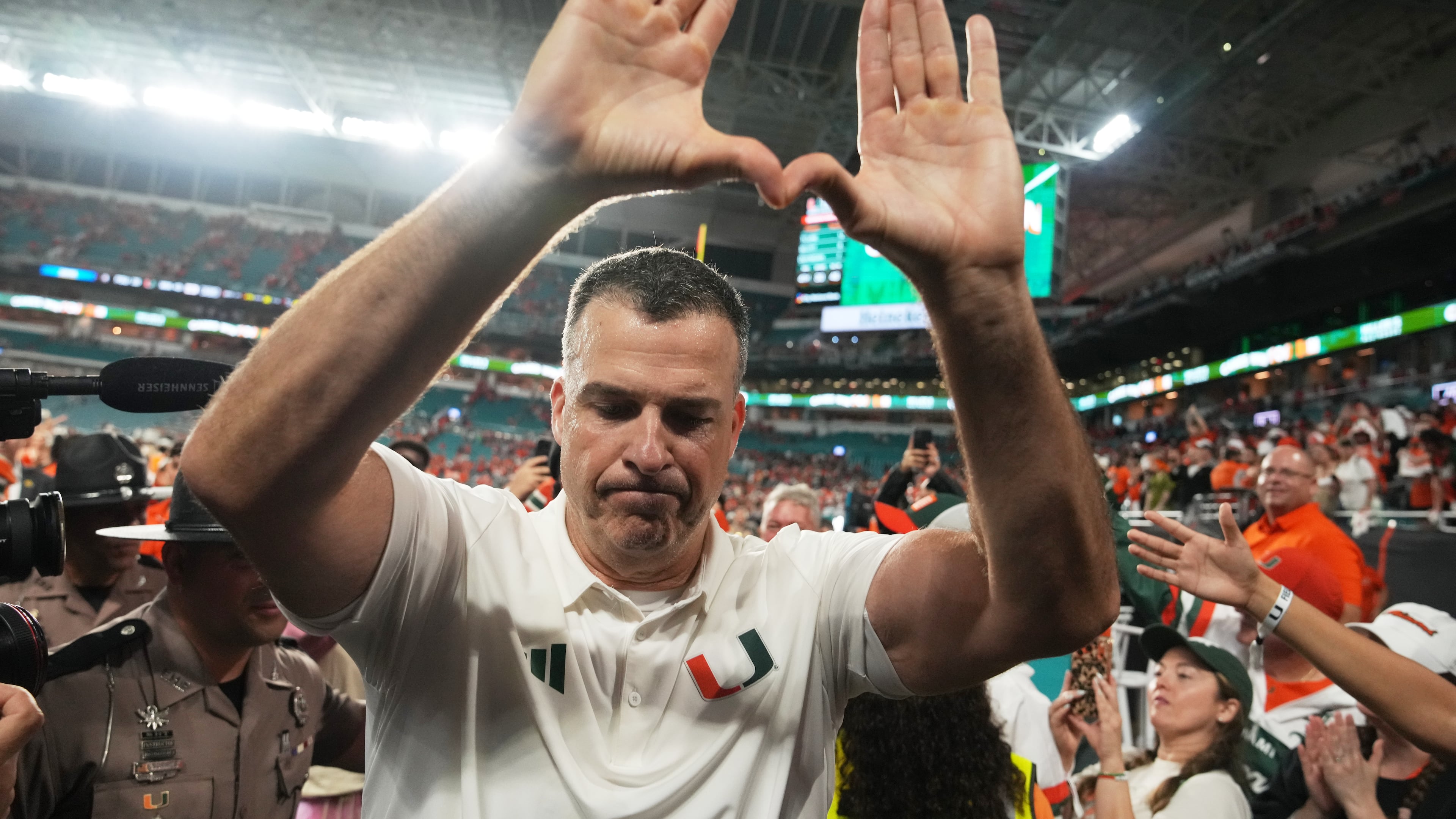 Miami head coach Mario Cristobal celebrates after Miami defeated Florida State in double overtime of an NCAA college football game, Saturday, Oct. 17, 2026, in Miami Gardens, Fla. (AP Photo/Lynne Sladky)