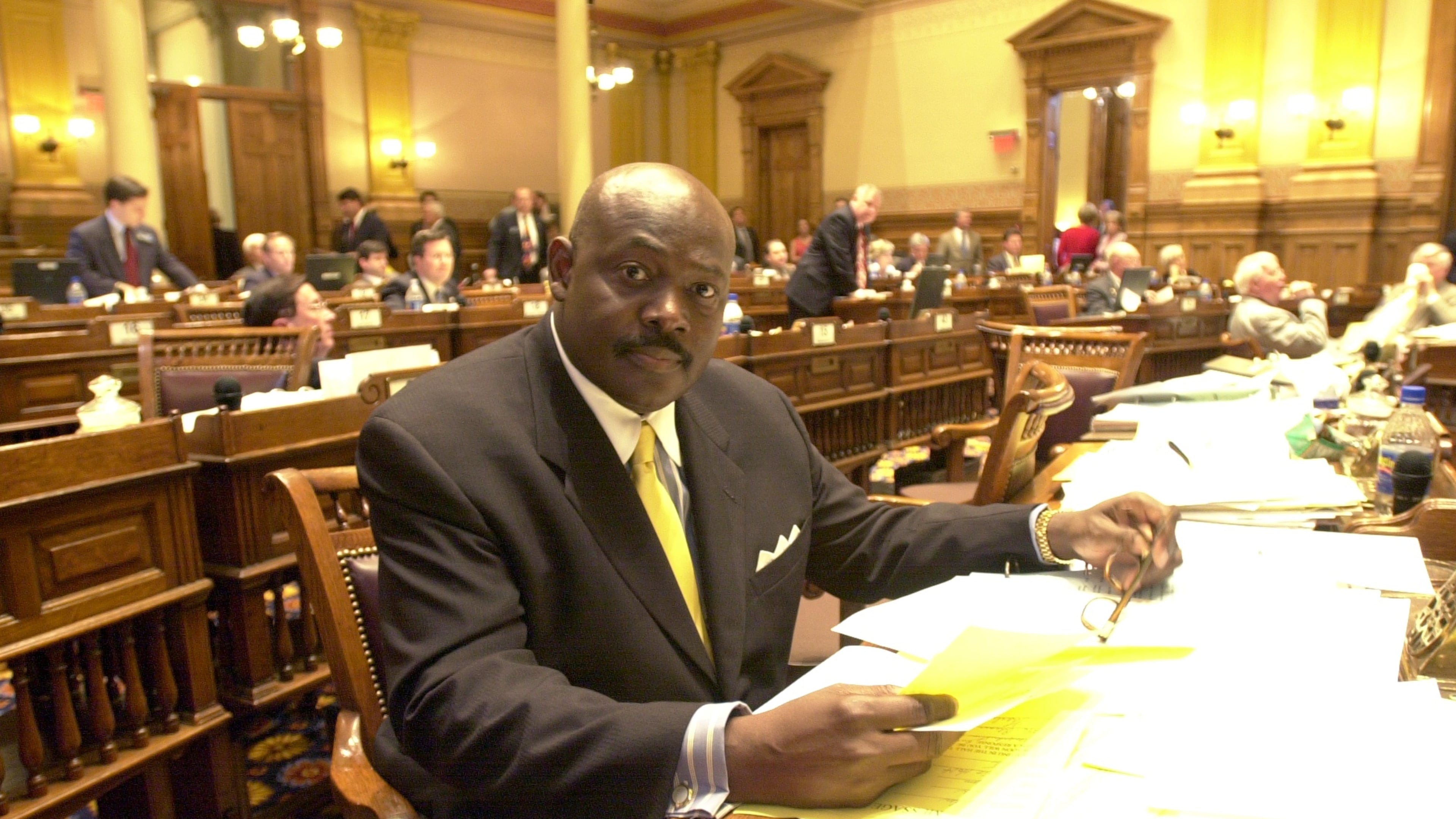 Charles Walker Sr., seen here as he sits at his desk in the state Senate in 2002. (W. A. Bridges Jr./AJC)