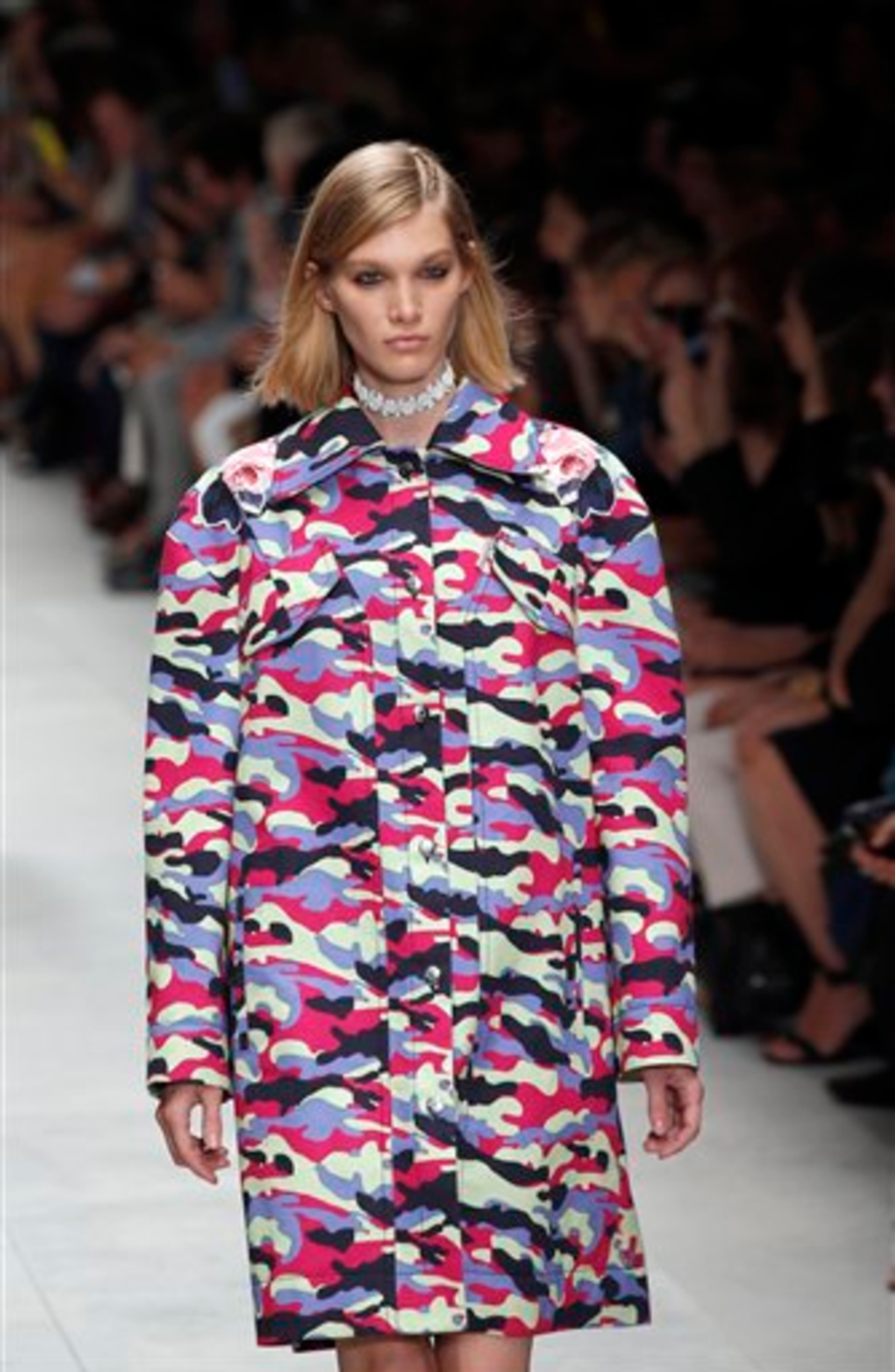 A model presents a creation as part of Carven's ready-to-wear Spring/Summer 2014 fashion collection presented in Paris, Thursday, Sept. 26, 2013. (AP Photo/Christophe Ena)