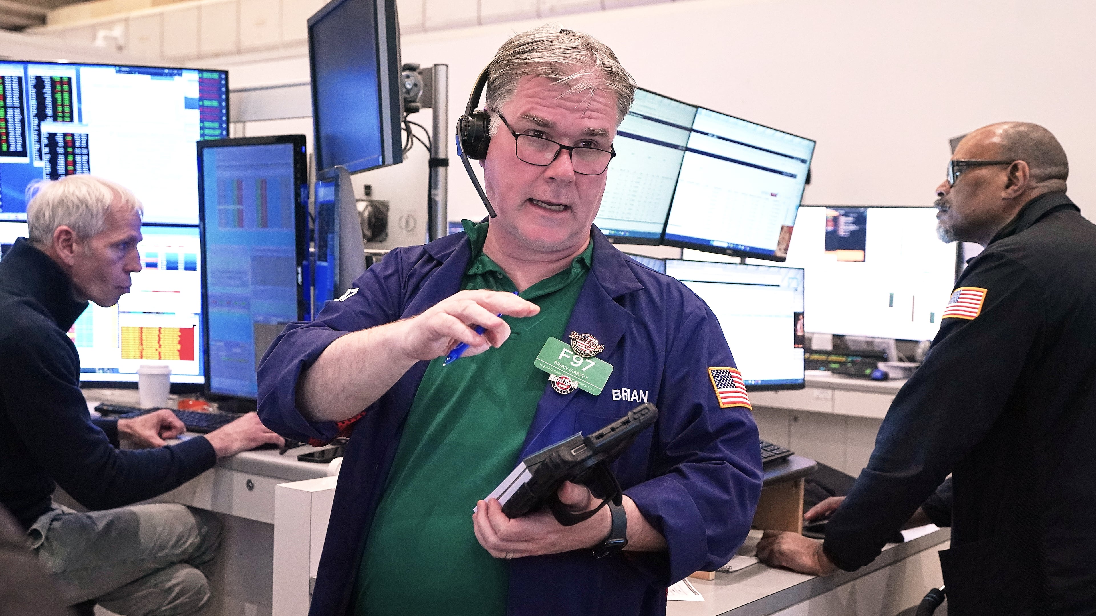 Options trader Brian Garvey, center, works on the floor of the New York Stock Exchange, Monday, May 11, 2026. (AP Photo/Richard Drew)