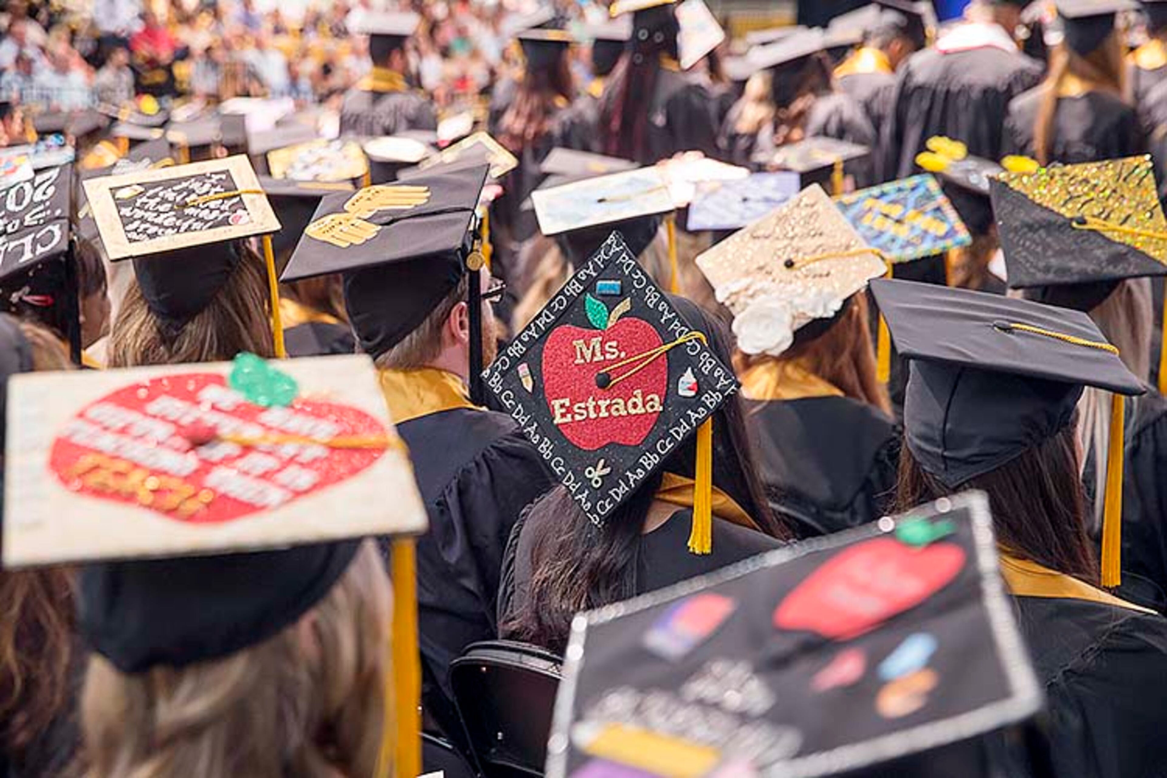Kennesaw State 2019: An entire crop of decorated caps on display. (Alyssa Pointer/AJC 2019 file)