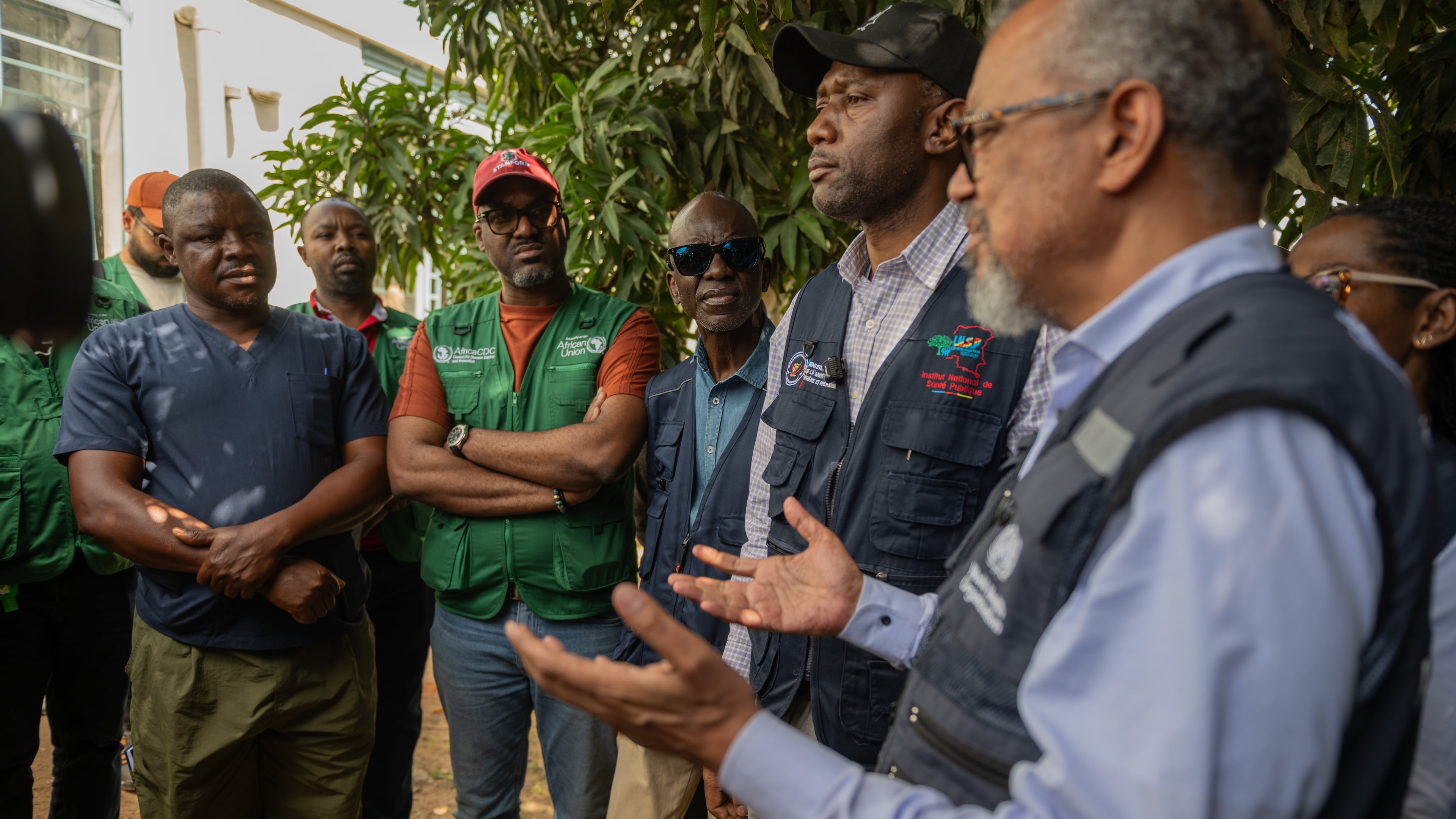 Director General of the World Health Organisation (WHO), Tedros Adhanom Ghebreyesus, meets with health workers who recovered from Ebola in Bunia, Congo, Sunday, May 31, 2026. (AP Photo/Moses Sawasawa)
