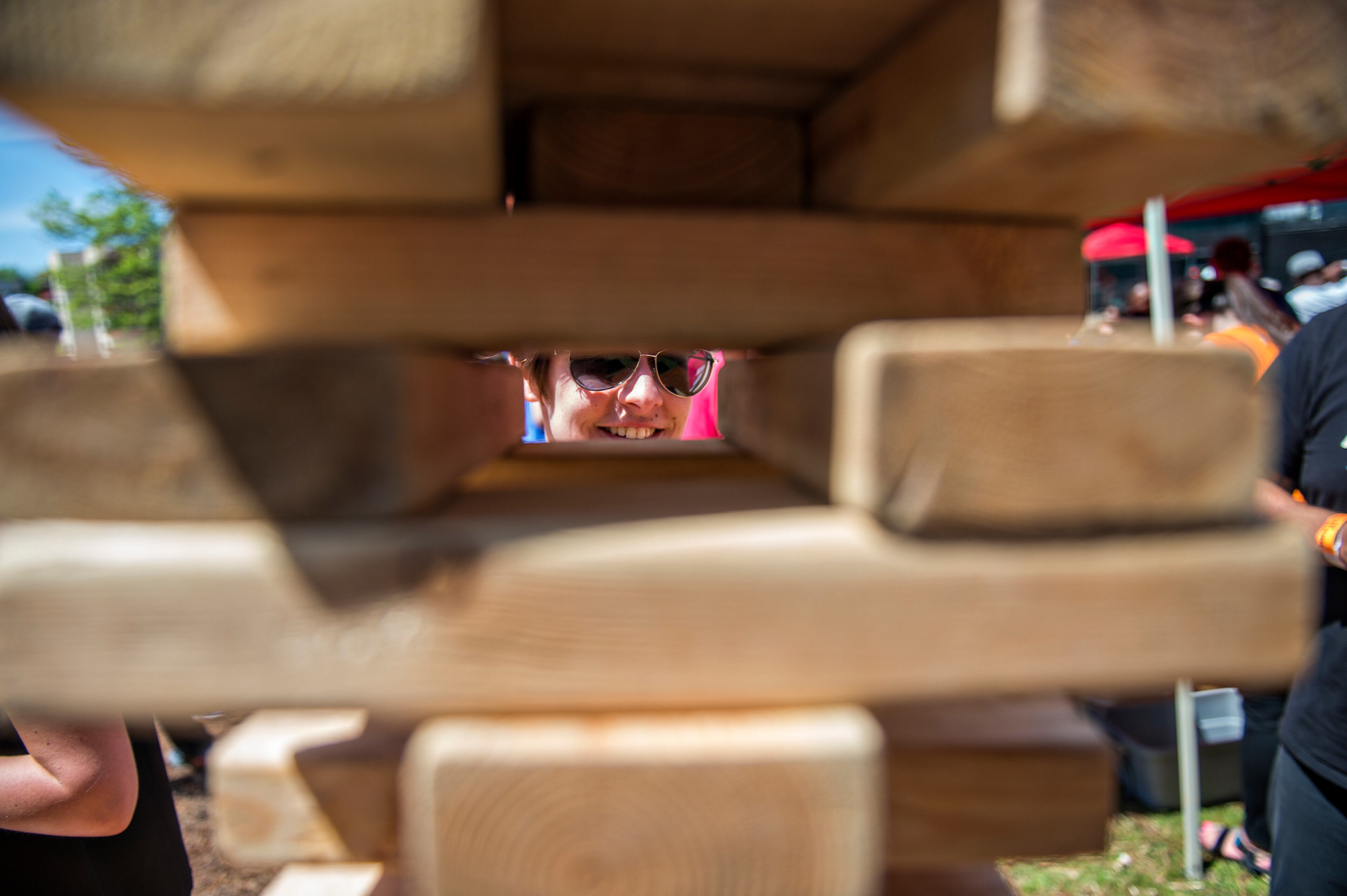 Caitlynn Hoffman (center) plays a game of Jenga during the Hogs & Hops Festival at The Masquerade in Atlanta on Saturday, April 11, 2015. The annual festival featured beer and barbeque as well as live music and games. JONATHAN PHILLIPS / SPECIAL