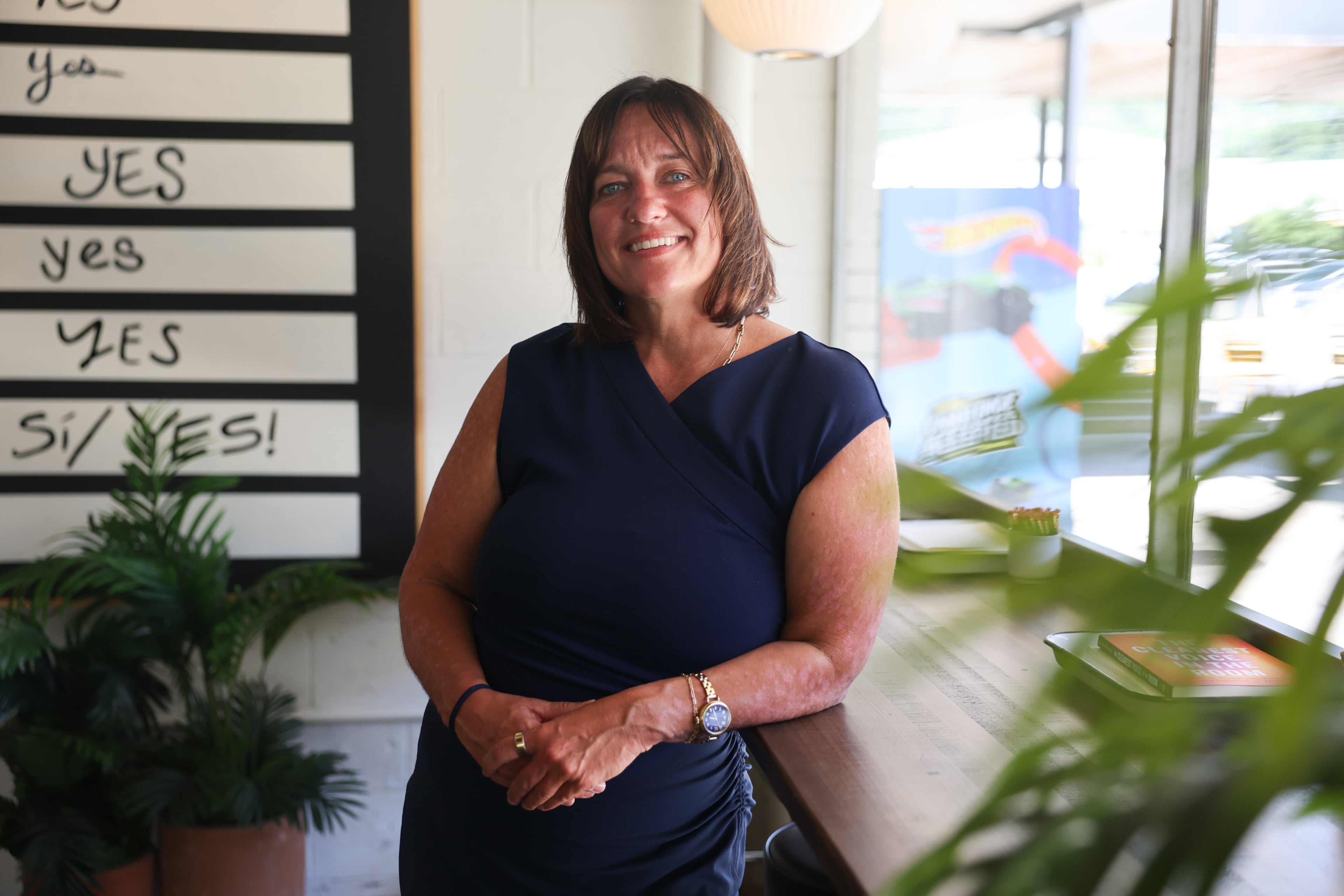 Kristine Sickels stands inside the Switchyards Toco Hills co-working space on Monday, Sept. 14, 2026. The author and marketing executive moved to Atlanta nearly 20 years ago. (Arvin Temkar/AJC)