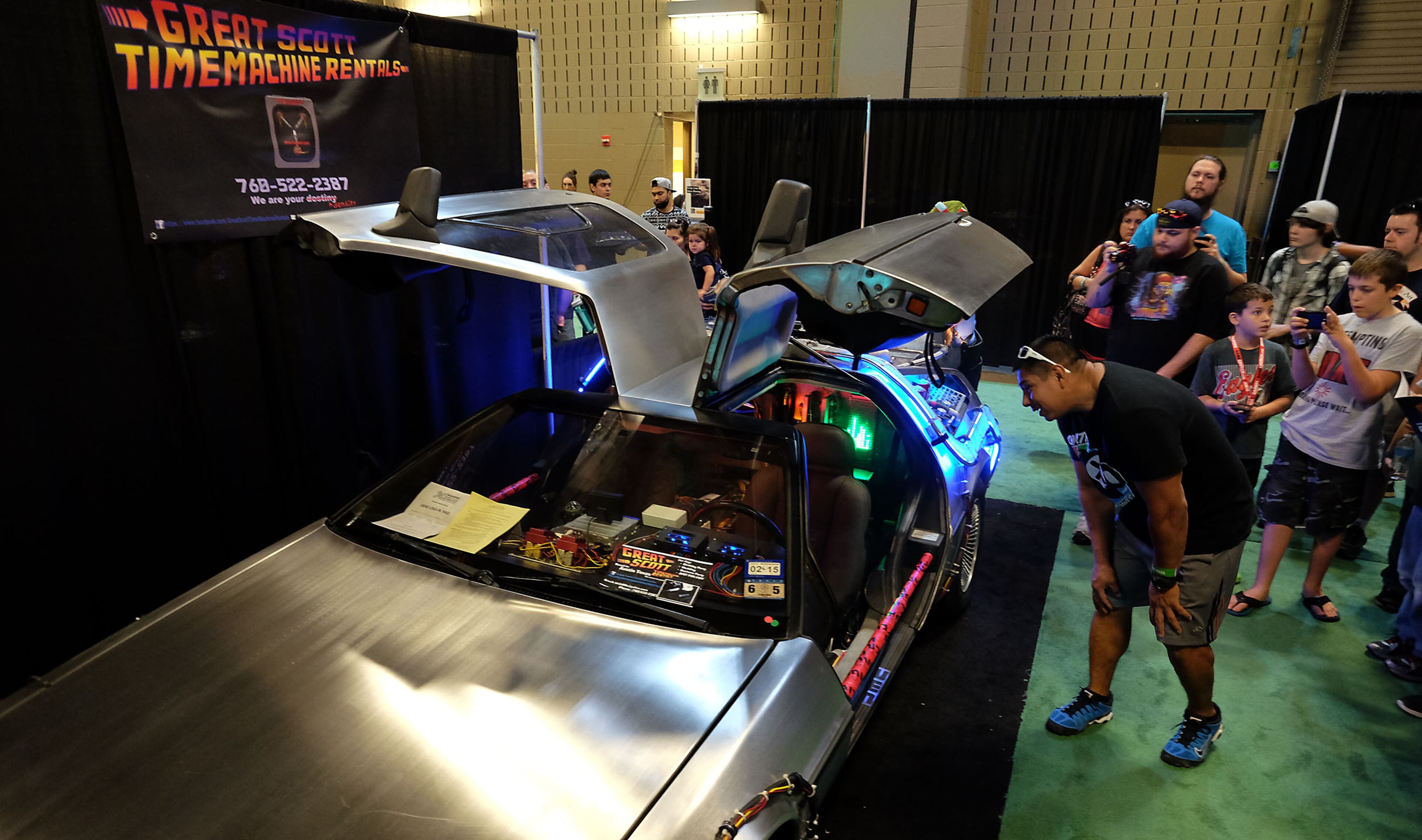 MARCH 14, 2015 - Gus Tavarez, of El Paso, Texas, takes a closer look at the Great Scott Timemachine Rentals, a replica time machine similar to the DeLorean in the movie, Back to the Future, on display at South by Southwest Gaming held in Austin, Tx., on Saturday, March 14, 2015. (RODOLFO GONZALEZ / AMERICAN-STATESMAN)