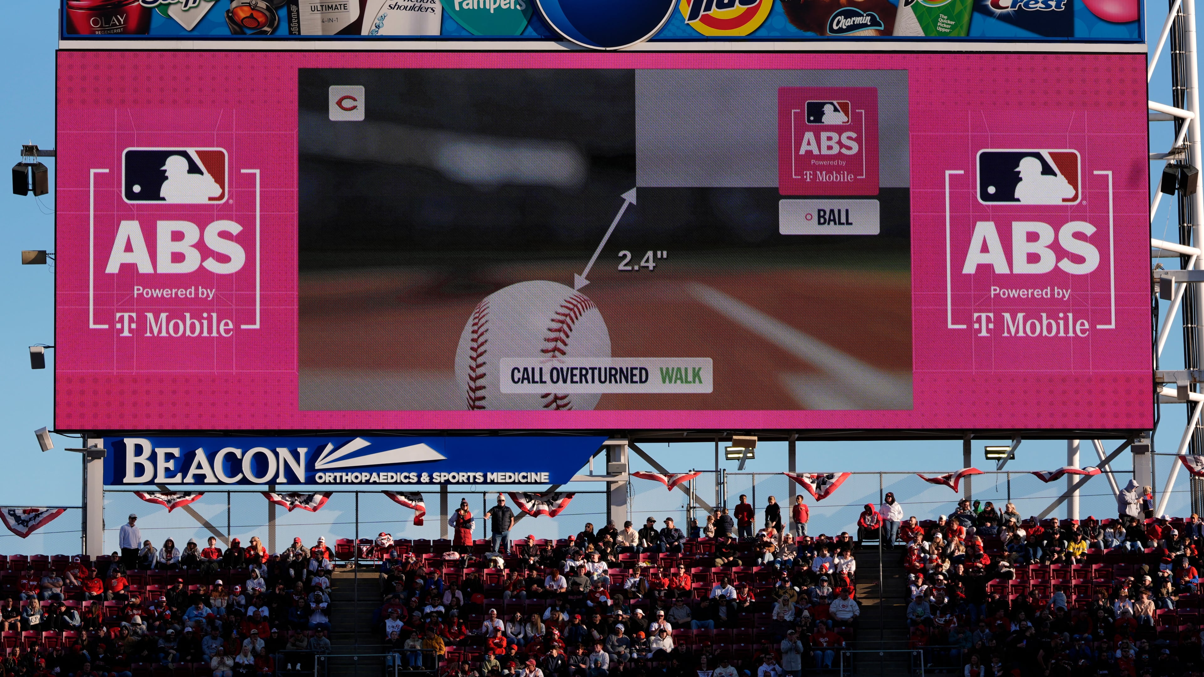 FILE - A call is overturned to a walk by the Automated Ball-Strike (ABS) Challenge System, displayed on the stadium screens, after Cincinnati Reds' Will Benson challenged at pitch result during the seventh inning of a baseball game against the Boston Red Sox in Cincinnati, March 28, 2026. (AP Photo/Carolyn Kaster, File)